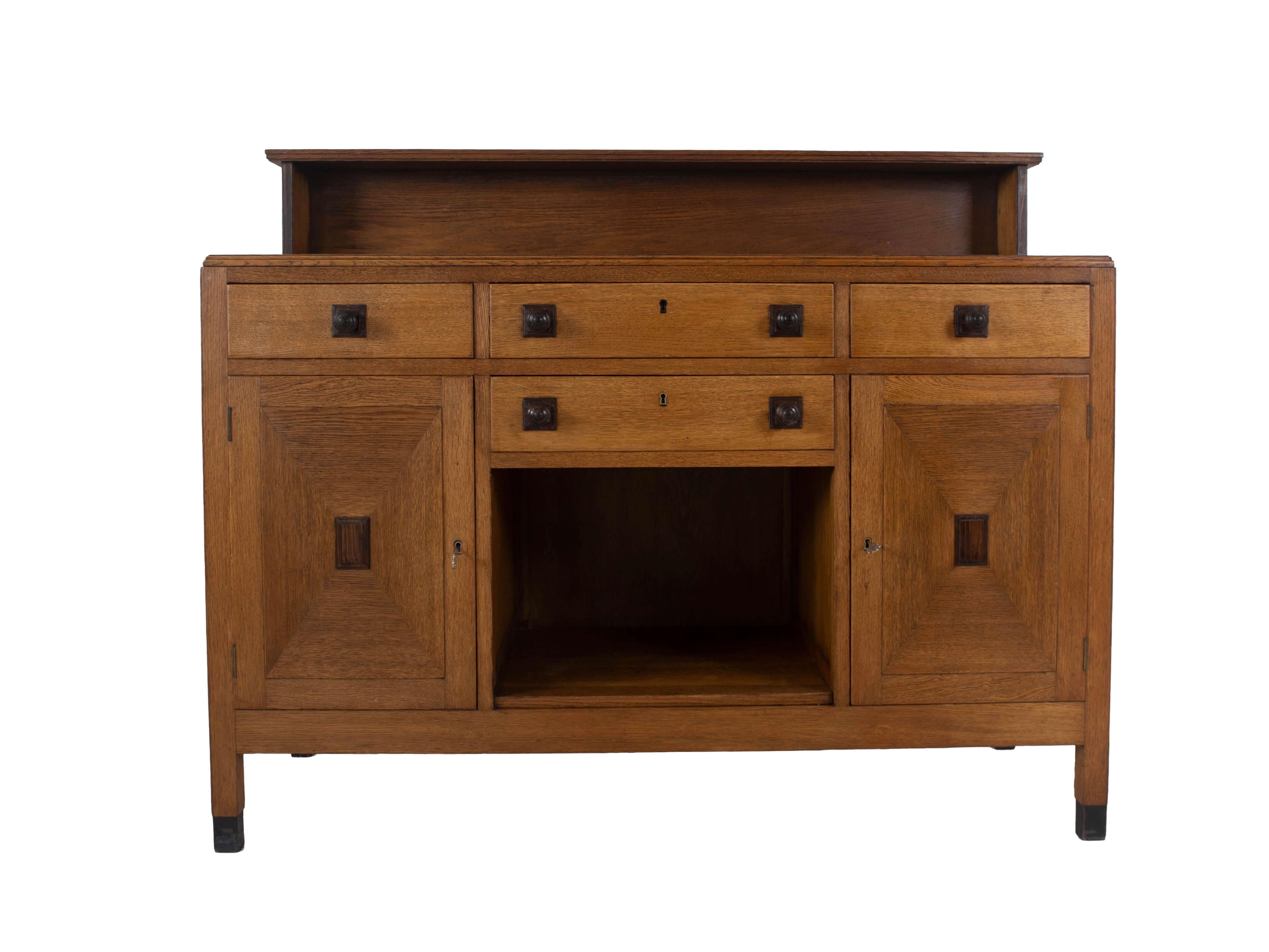 Art Deco / Hague School buffet / cabinet in oak wood. This piece of furniture is marked by the dealer Bern. Vos from The Hague. He was registered with his store in the Dutch telephone book from the year 1915. His address was 'Van De Spiegelstraat