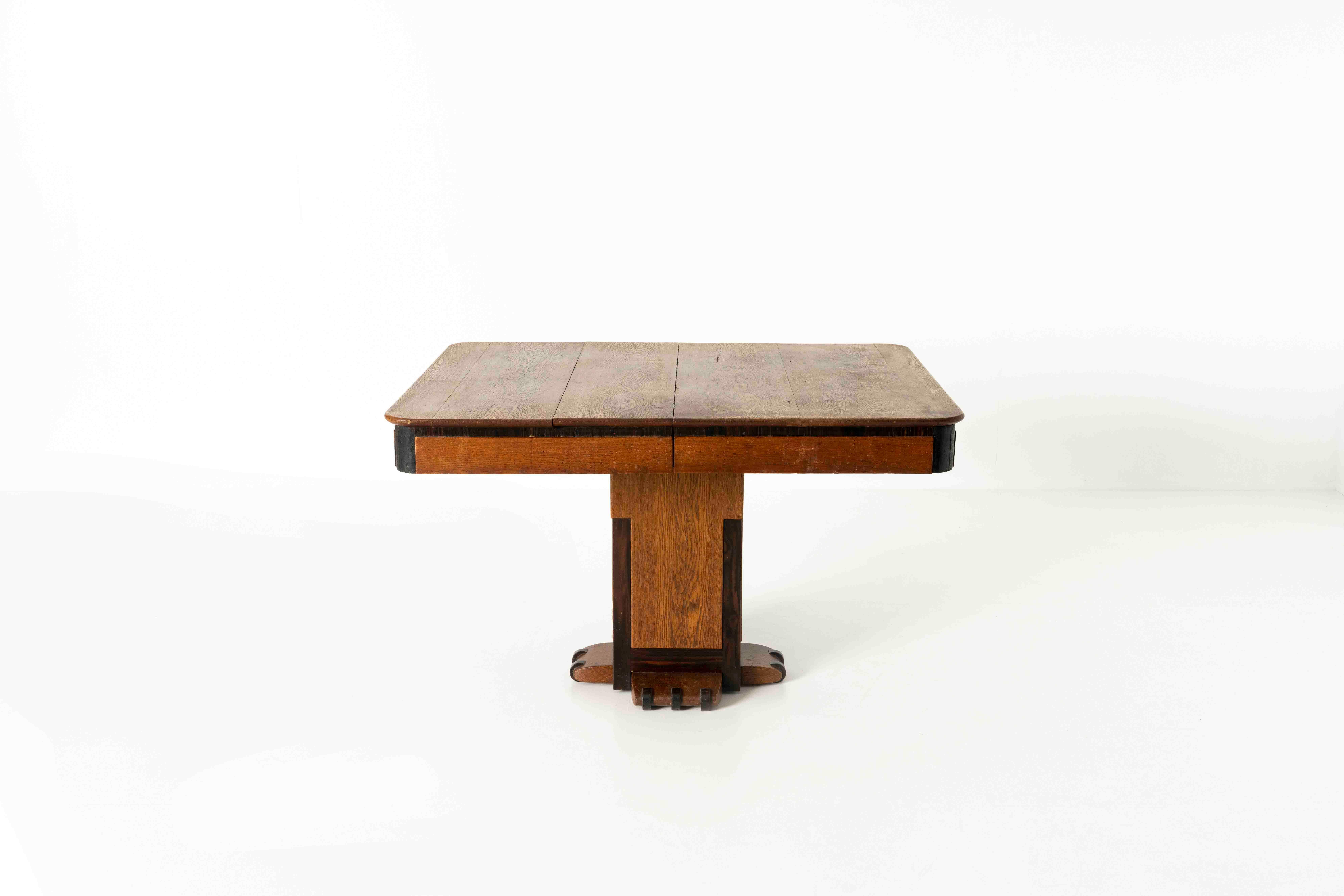 Robust The Hague School Extendable Dining Table, The Netherlands ca 1920s. This table has an impressive base which we think looks like a 'lion's claw'. The top hides two additional elements that in total make the table 187 cm in width. It is in use,