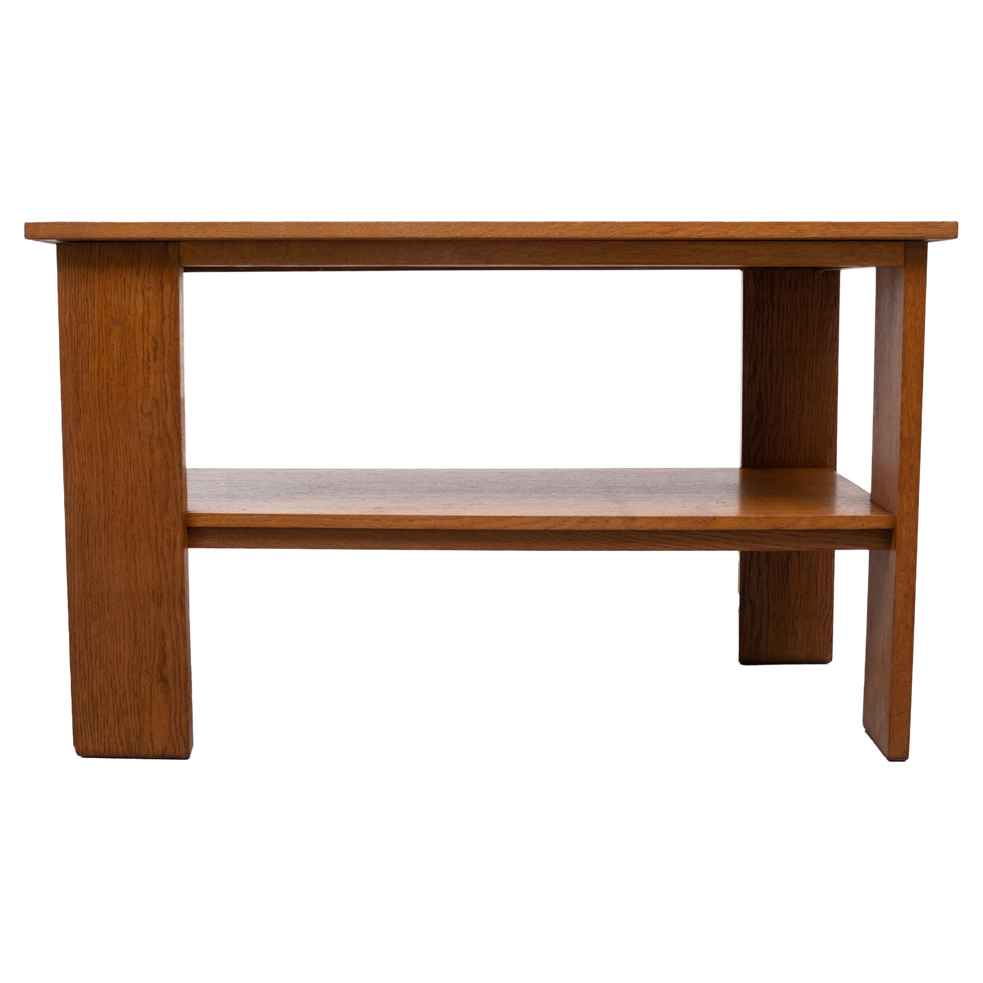 Solid oak side table attributed to Hendrik Wouda 1920/30 The Hague School featured symmetrical and asymmetrical lines, almost no ornamentation, Dutch Art Deco. Still in a very good condition.