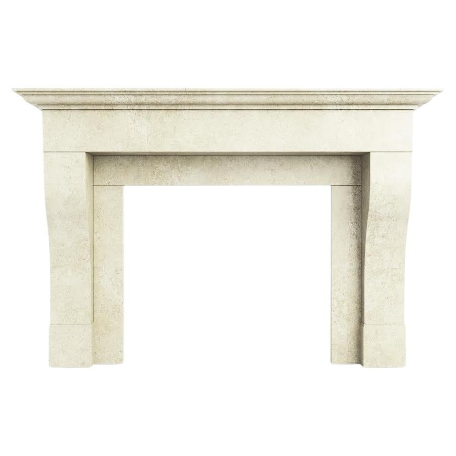 The Hamilton: A Simple Carved Limestone Fireplace in the French Provincial Style For Sale
