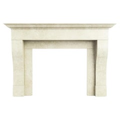 The Hamilton: A Simple Carved Limestone Fireplace in the French Provincial Style