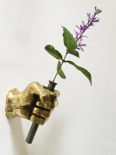 bronze wall sculpture,    by Gustavo Dias