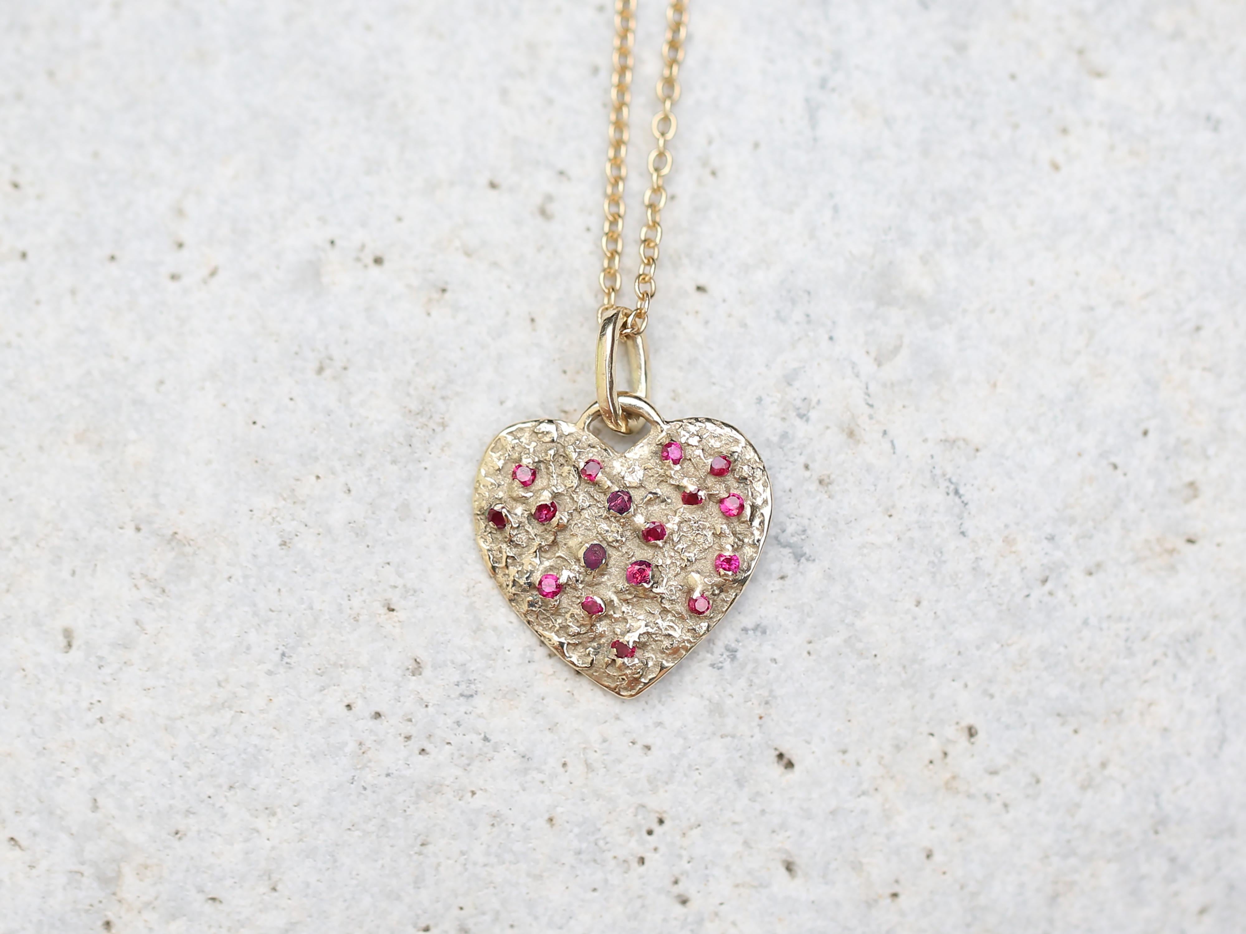 Large Solid Yellow Gold Heart of 17 Rubies Necklace

17 carefully selected ruby stones shine in the heart of a lady.
The pendant is crafted in wax and then cast in gold.

Materials: Heart Pendant: Solid 14k Gold
Size approx: 0.73