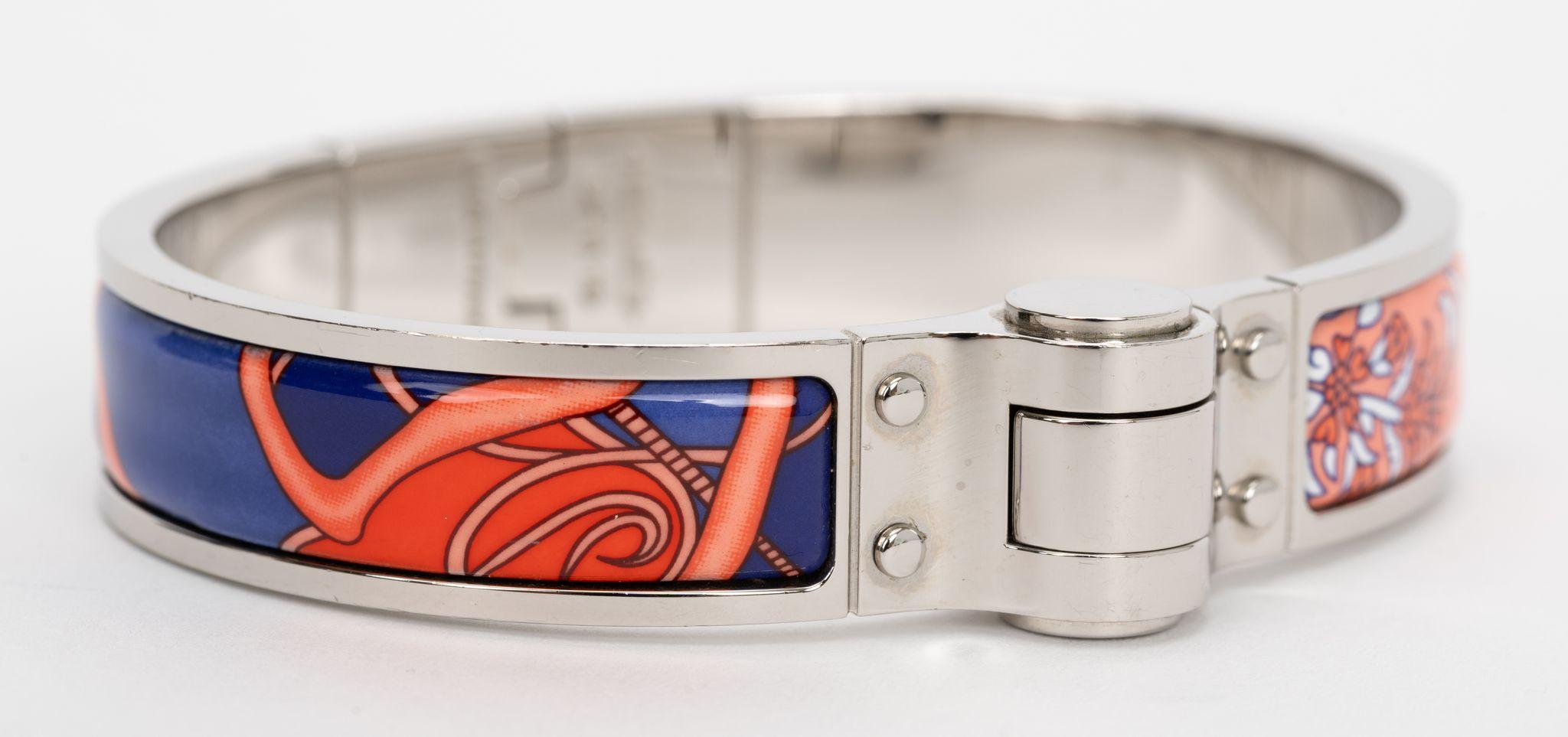 The Hermes Coup De Fouet Hinged Bracelet features an enamel and silver palladium body. The beautiful silhouette is complete with a push-clasp. Size small, circumference 7.5