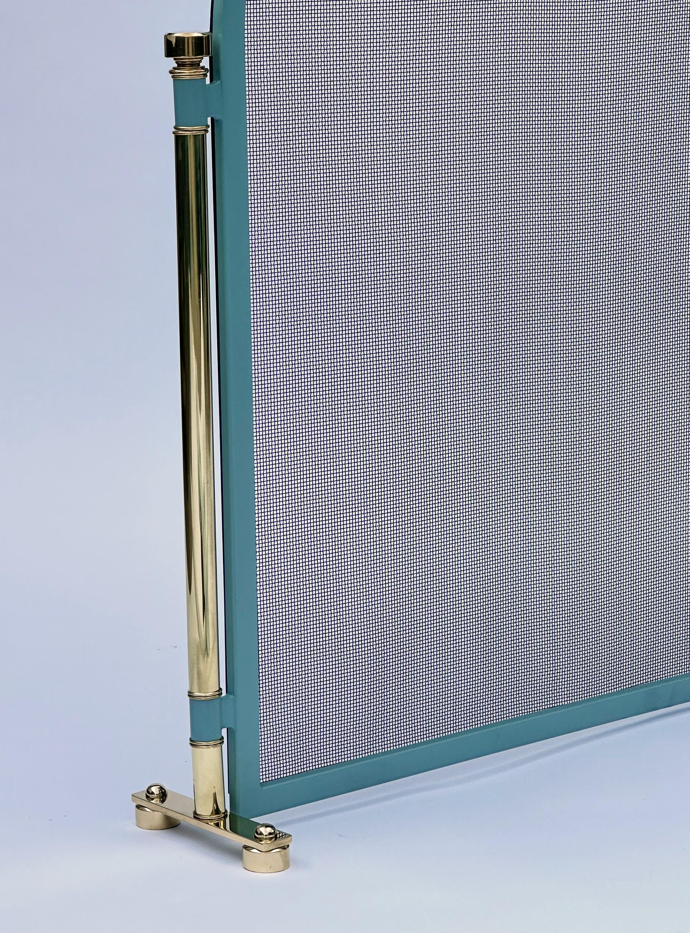 The Hernan Brass & Painted steel fire screen. 
   This is our newest and hottest design which consists of a steel frame painted in any color which is supported by beautiful solid brass uprights.   Just tell us the color you would like, Ben Moore,