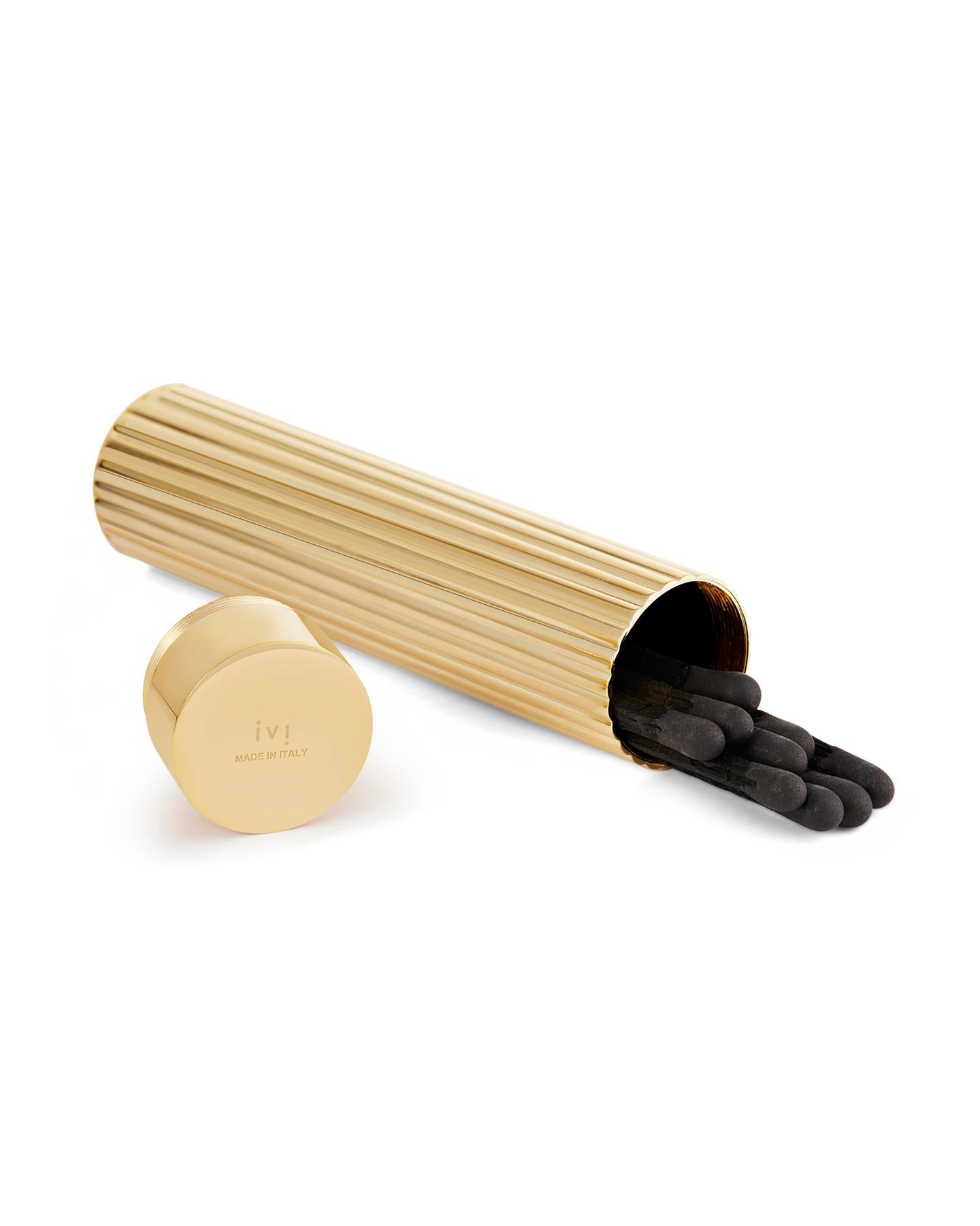 Matchbox Details: 
The cylindrical matchbox is Made in Italy from 18K gold-plated brass. 
Length: 4 inches
Diameter: 1 inch
Includes a set of black on black matches.

Candle Details: 
Hand Poured in Grasse (World’s Perfume Capital), France 
Made out