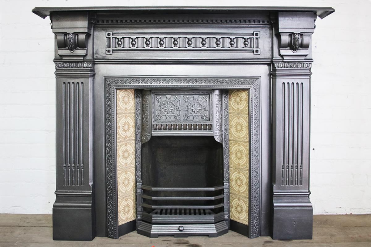 19th century Victorian cast iron fireplace surround called The Homeruler, circa 1886-1889.
Pictured with an original cast iron and tiled grates, priced separately.

This surround has been finished with traditional black grate polish, leaving a