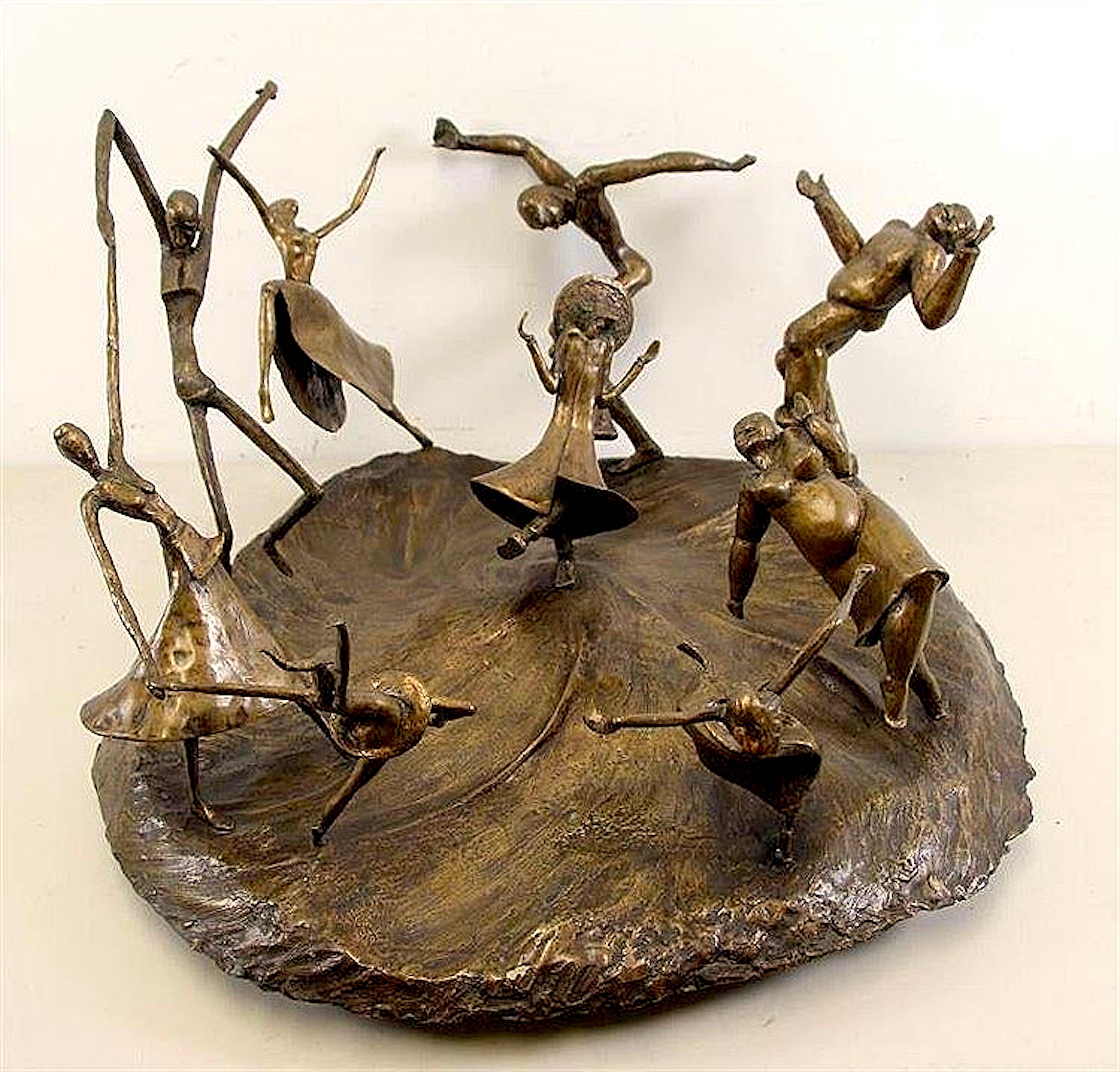 A very lively and joyous bronze sculpture of a group dancing the Horah. Singed in numerous places measuring 30