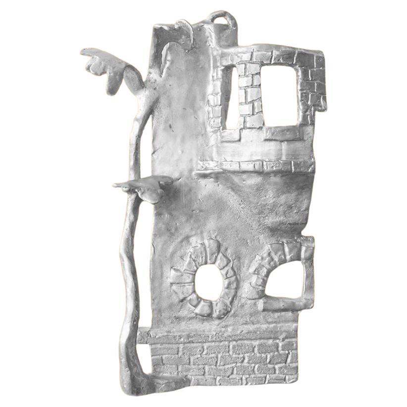 Handmade Aluminium cast wall sculpture depicting"The House Behind The Fence III" For Sale
