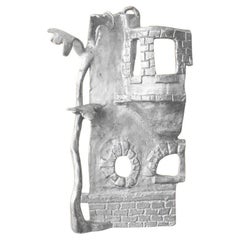 Handmade Aluminium cast wall sculpture depicting"The House Behind The Fence III"