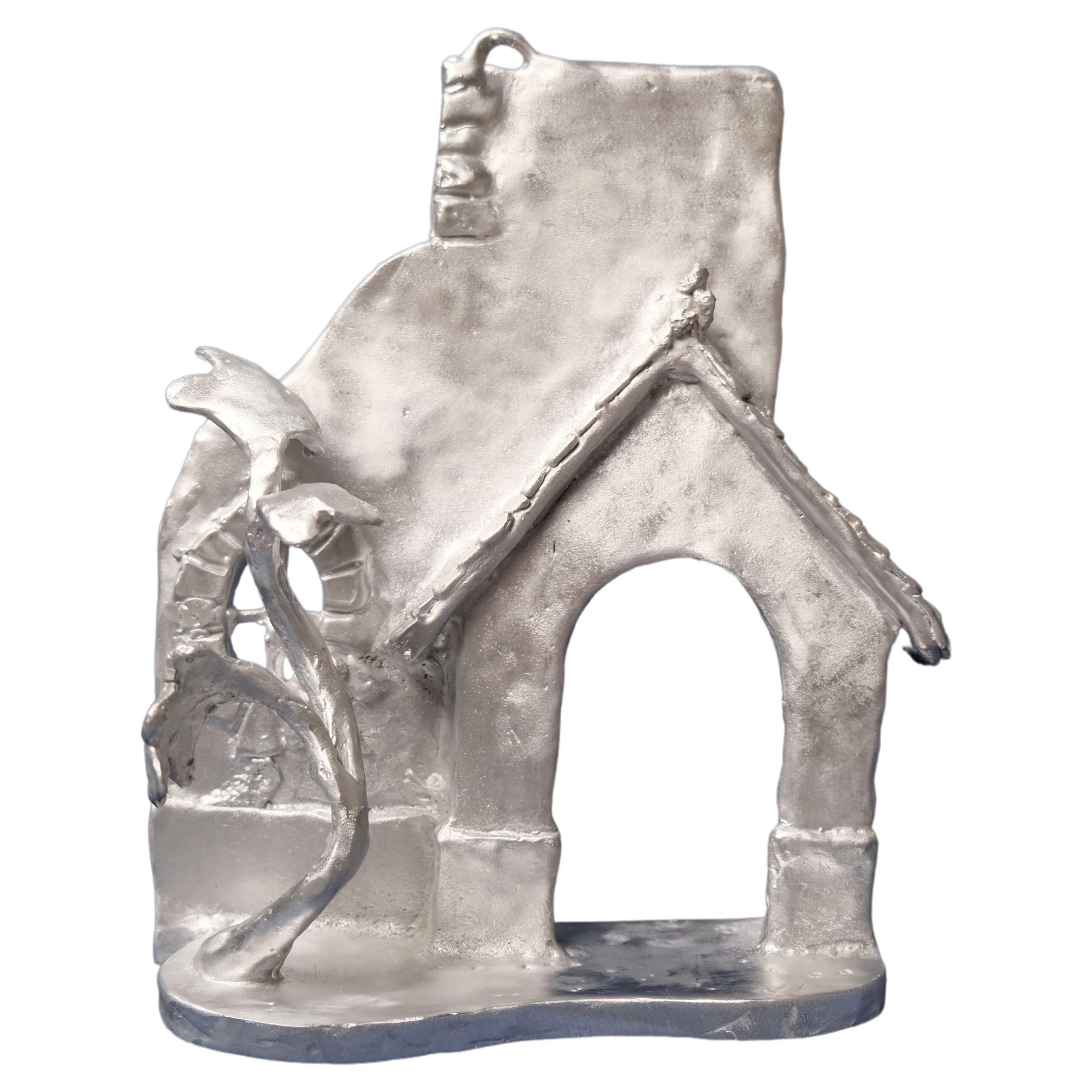 Handmade Aluminium cast wall sculpture depicting "The House Behind the Fence IV" For Sale