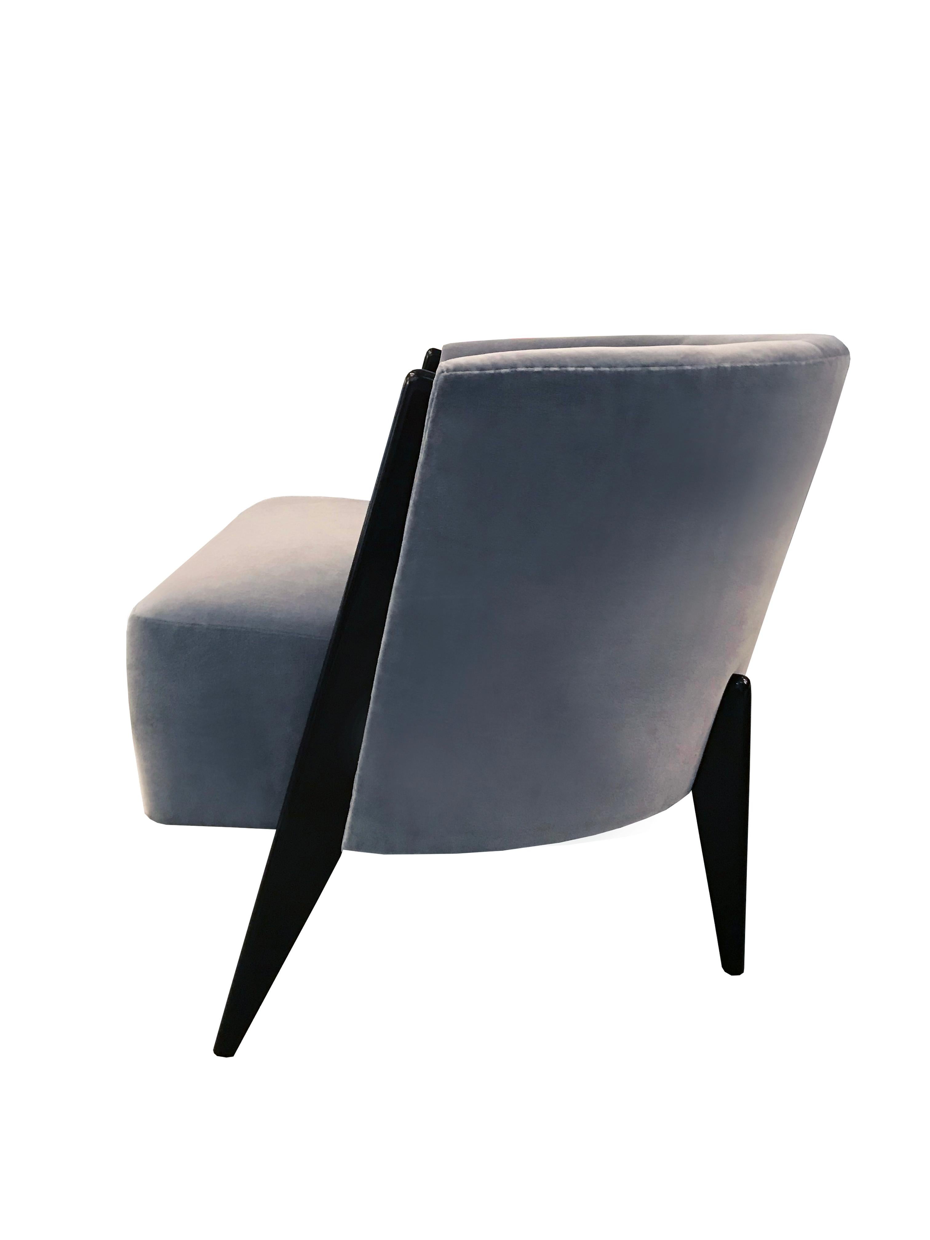 The Hudson chair, designed by Irwin Feld for CF Modern, has a rounded back that is sectioned into three panels and hugs the thick seat cushion. Shown here finished in Dark Walnut with a blue grey upholstery.

CF Modern merchandise is available in