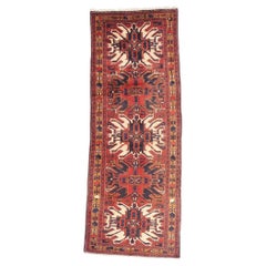 The Imperial Crimson Crest: Vintage Persian Heriz Masterpiece of Tribal Nobility