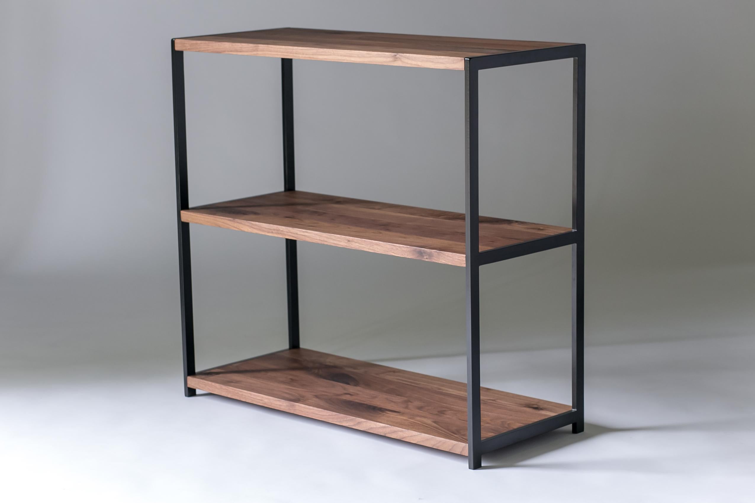 The Index, Modern Walnut and Powder Coated Steel Bookshelf.

The Walnut bookshelf provides the perfect place to display everything from book collections, prized photos, to a turntable and speakers. Three solid walnut shelves are supported by a