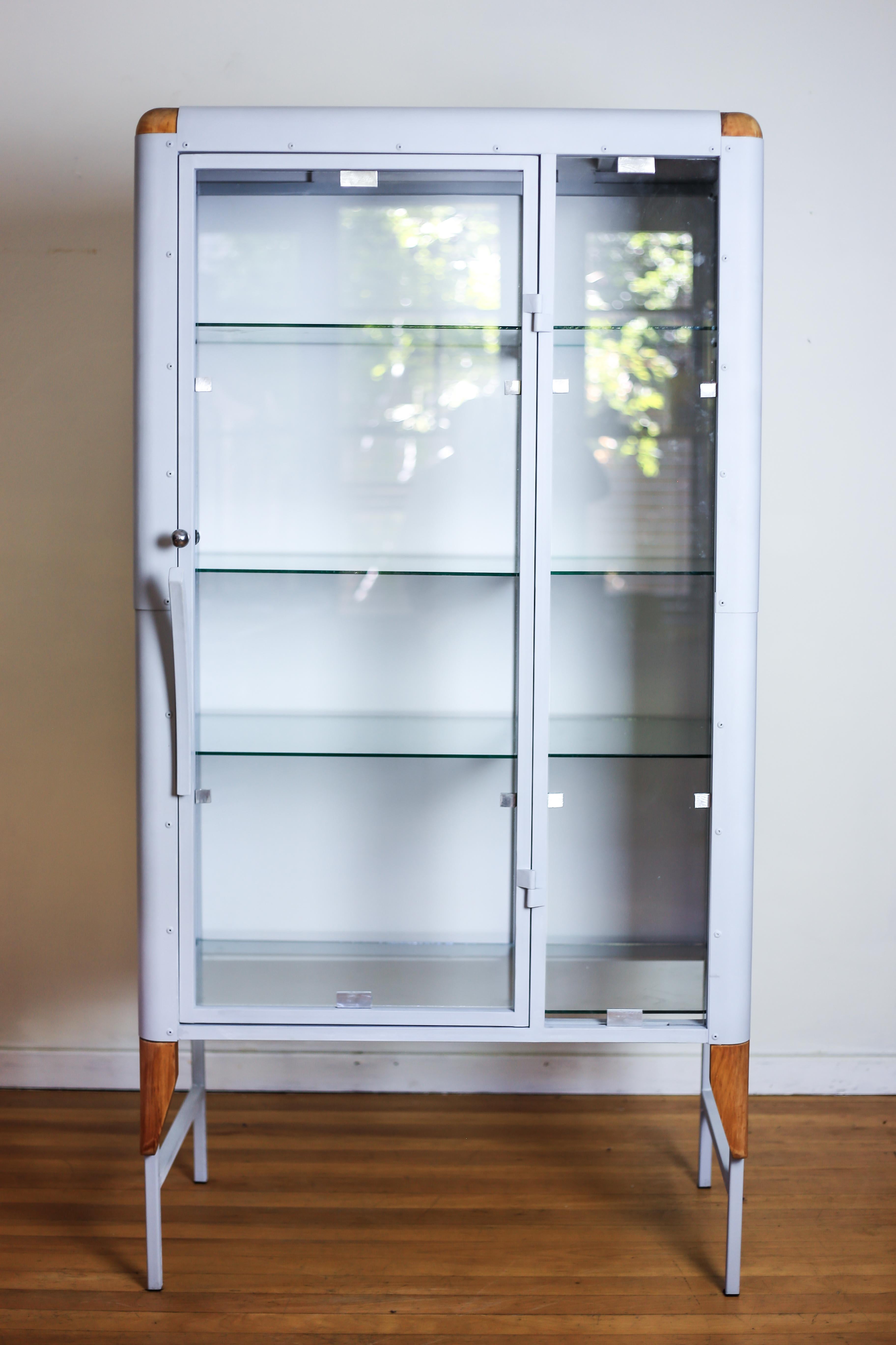 A limited edition, handmade to order cabinets by South African furniture designer, Glen Napier. This display case is a modern take on medical cabinets of the early previous century. Like it's predecessors, it is predominantly made of steel and