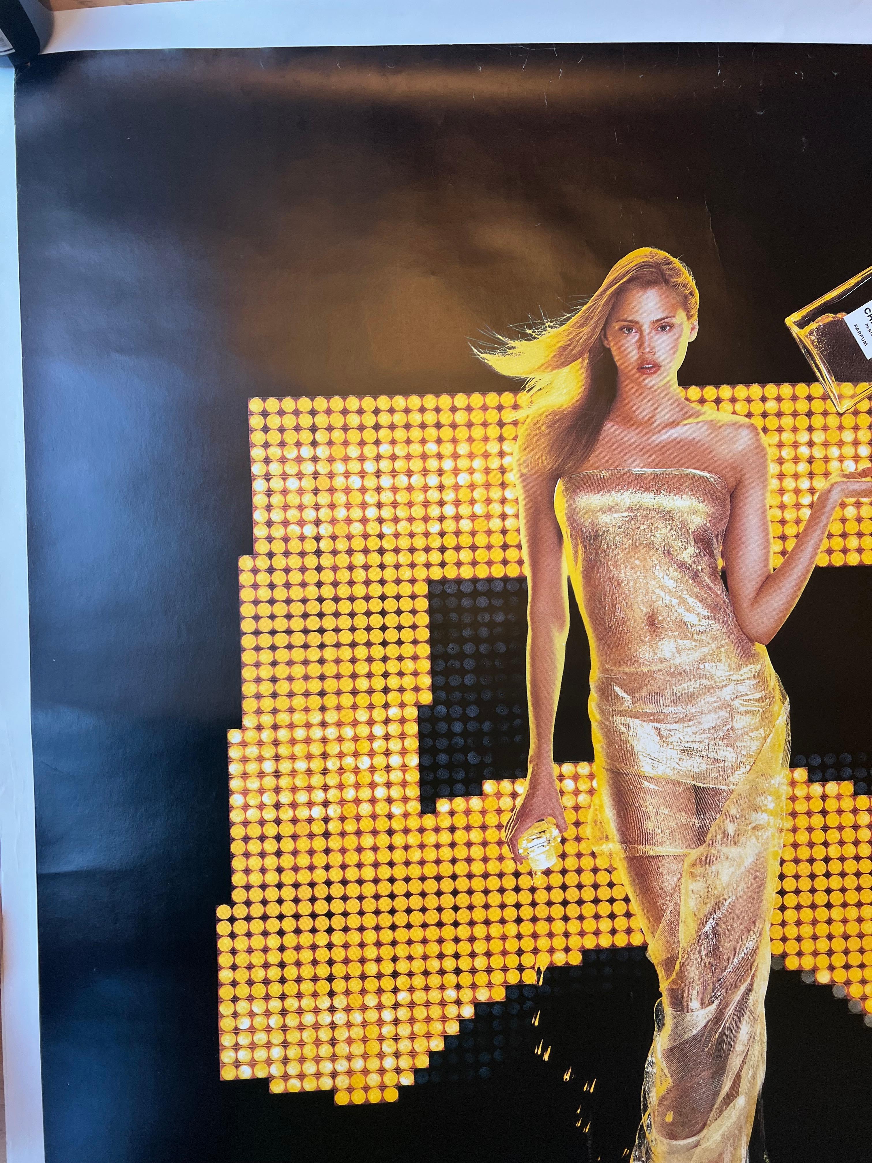 The infamous Red Dress Chanel No. 5 poster starring Estella Warren by artist Jean Paul Goude, featuring a captivating Estella in a stunning red gown, set against bold, stylish design. 

It's an original double-sided poster for Chanel No. 5, once