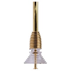 The Insulator 'A' Pendant in polished brass and clear glass by NOVOCASTRIAN deco