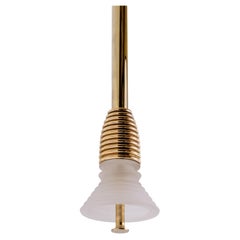 The Insulator 'A' Pendant in polished brass and frosted glass by NOVOCASTRIAN