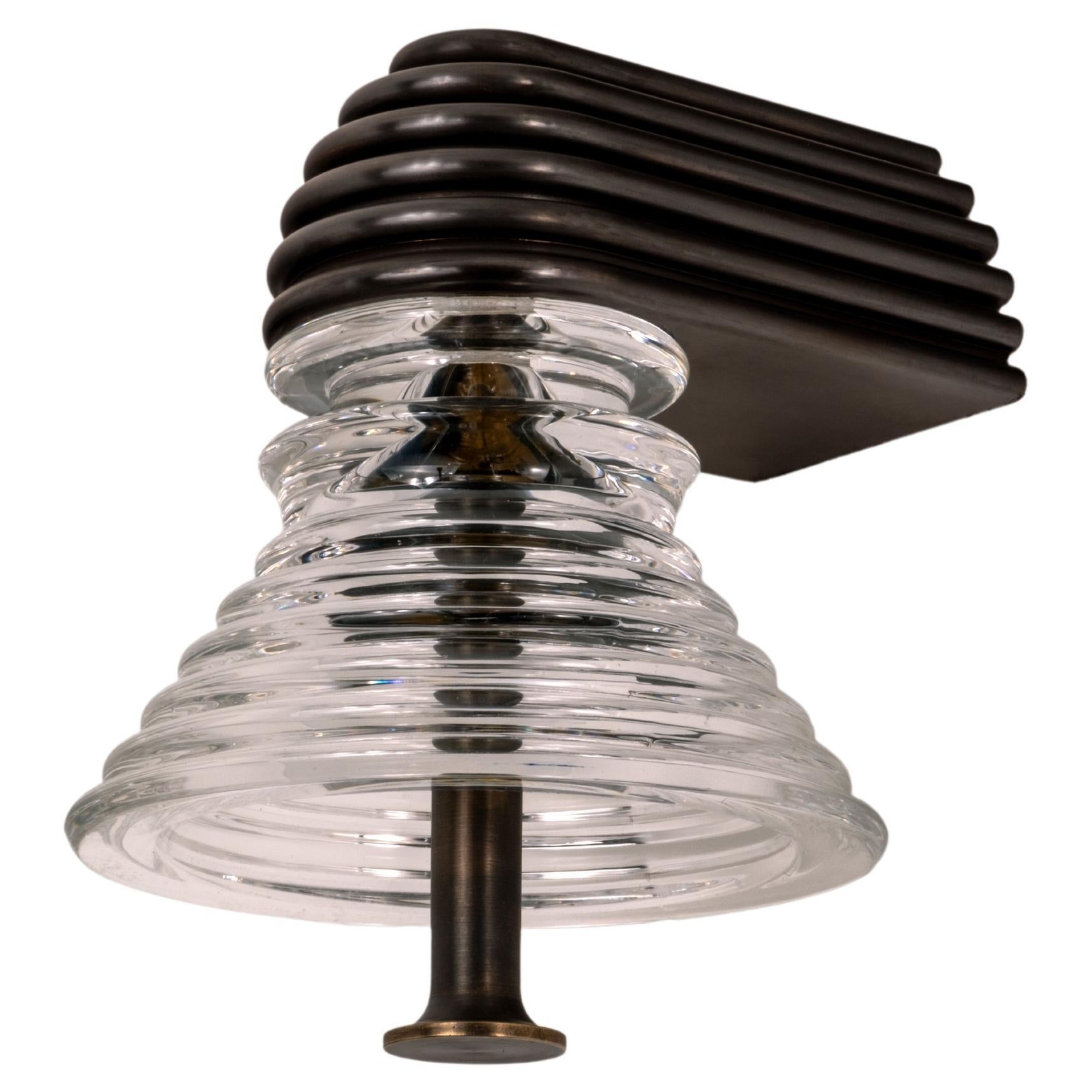 The Insulator 'A' Sconce in dark brass and clear glass by NOVOCASTRIAN deco For Sale