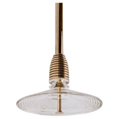 The Insulator 'B' Pendant in polished brass and clear glass by NOVOCASTRIAN deco