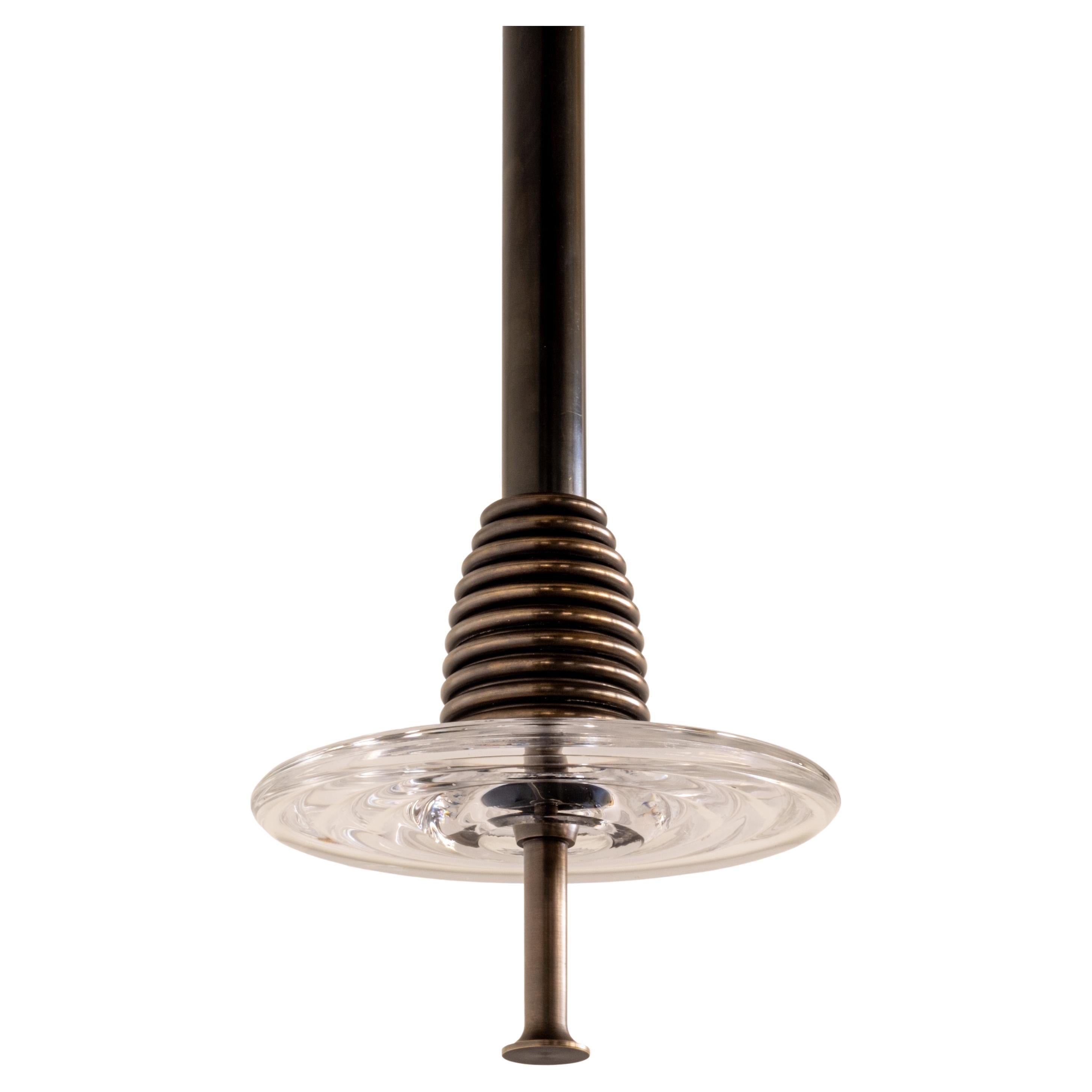 The Insulator 'C' Pendant in dark brass and clear glass by NOVOCASTRIAN