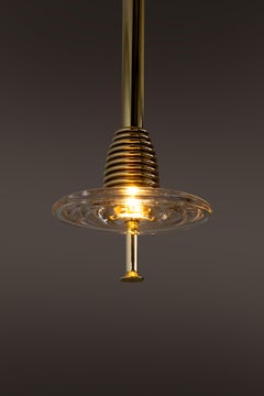 The Insulator 'C' Pendant Light in Polished Brass & Clear Glass by NOVOCASTRIAN