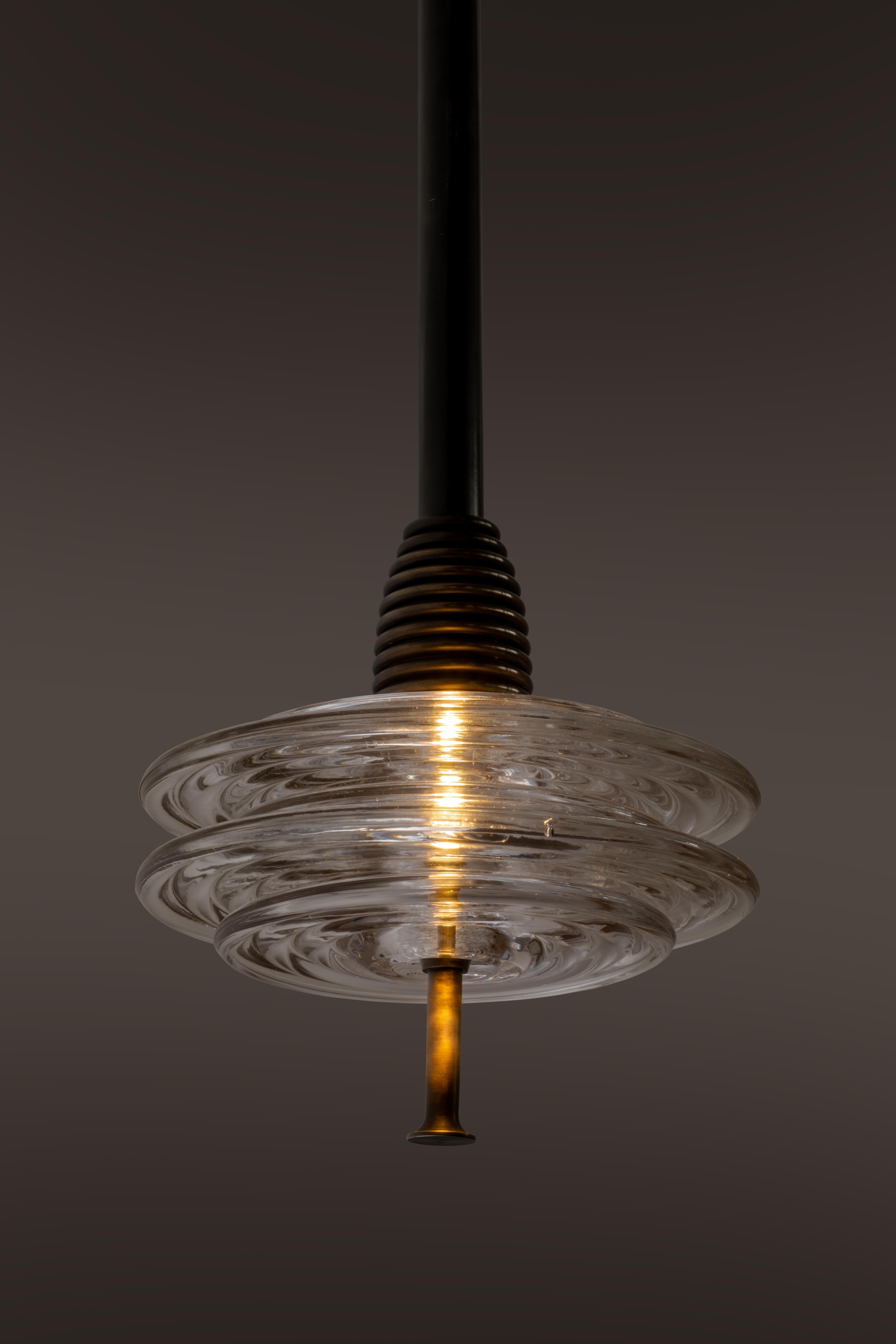 Inspired by our founder Richy's endless train journeys up and down Britain's East Coast mainline, by the rhythmic lattice of the overhead power lines, and by the intriguing saucer-like pin insulators which adorn them, The Insulator Collection is