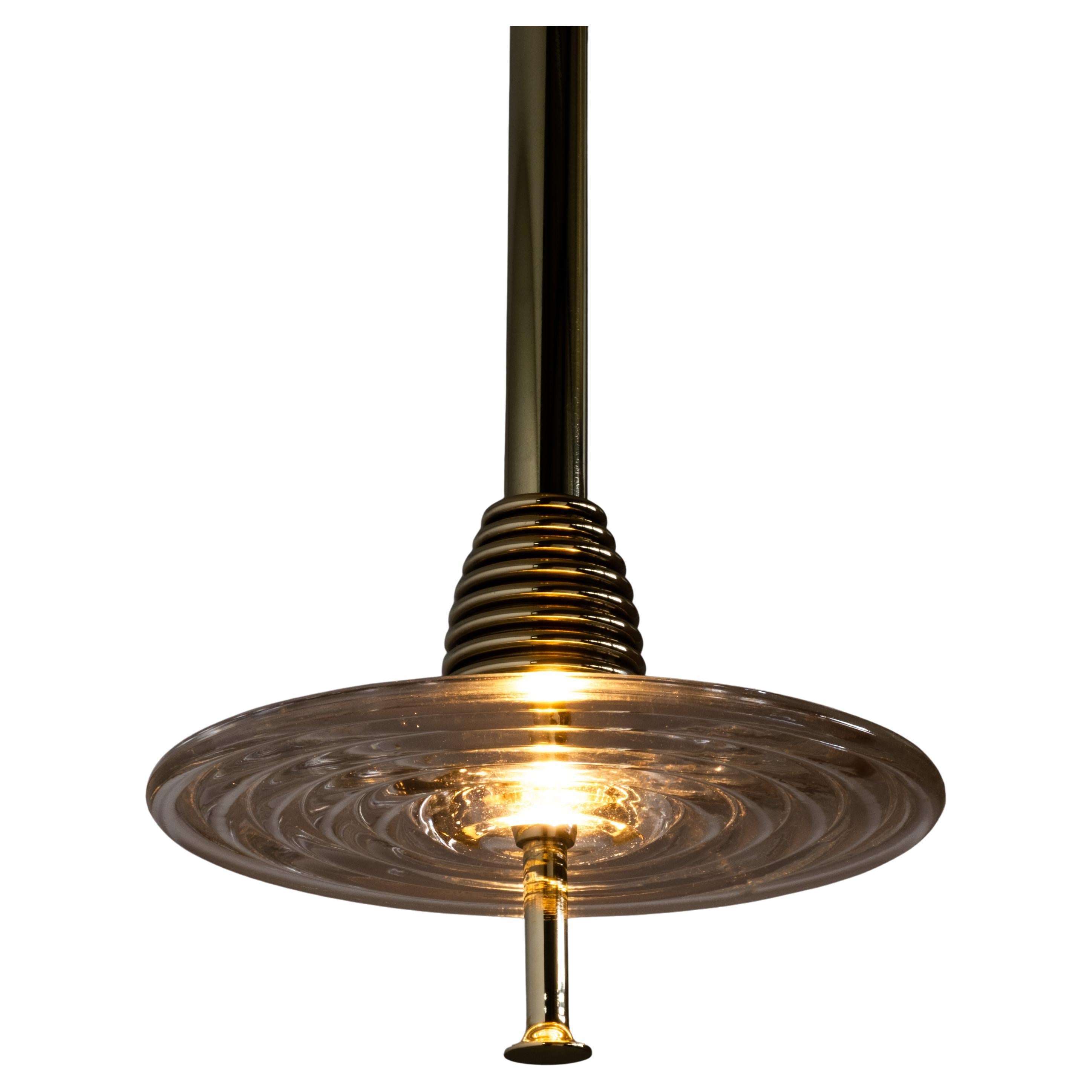 The Insulator 'D' Pendant in polished brass and clear glass by NOVOCASTRIAN