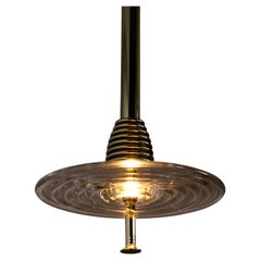 The Insulator 'D' Pendant in polished brass and clear glass by NOVOCASTRIAN