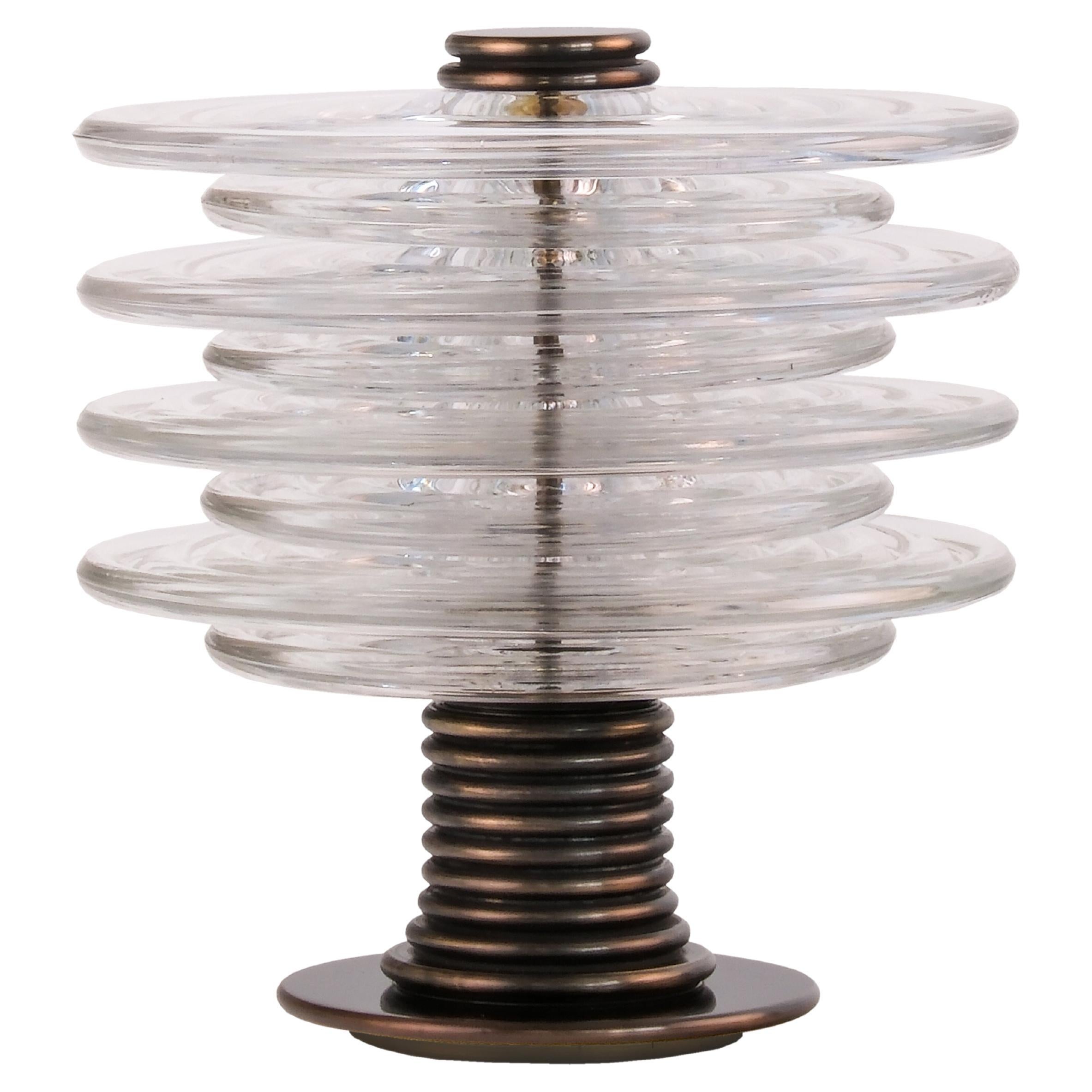 The Insulator Table Lamp in dark brass and clear glass by NOVOCASTRIAN