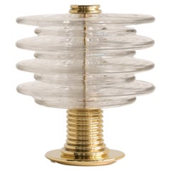 The Insulator Table Lamp in polished brass and clear glass by NOVOCASTRIAN