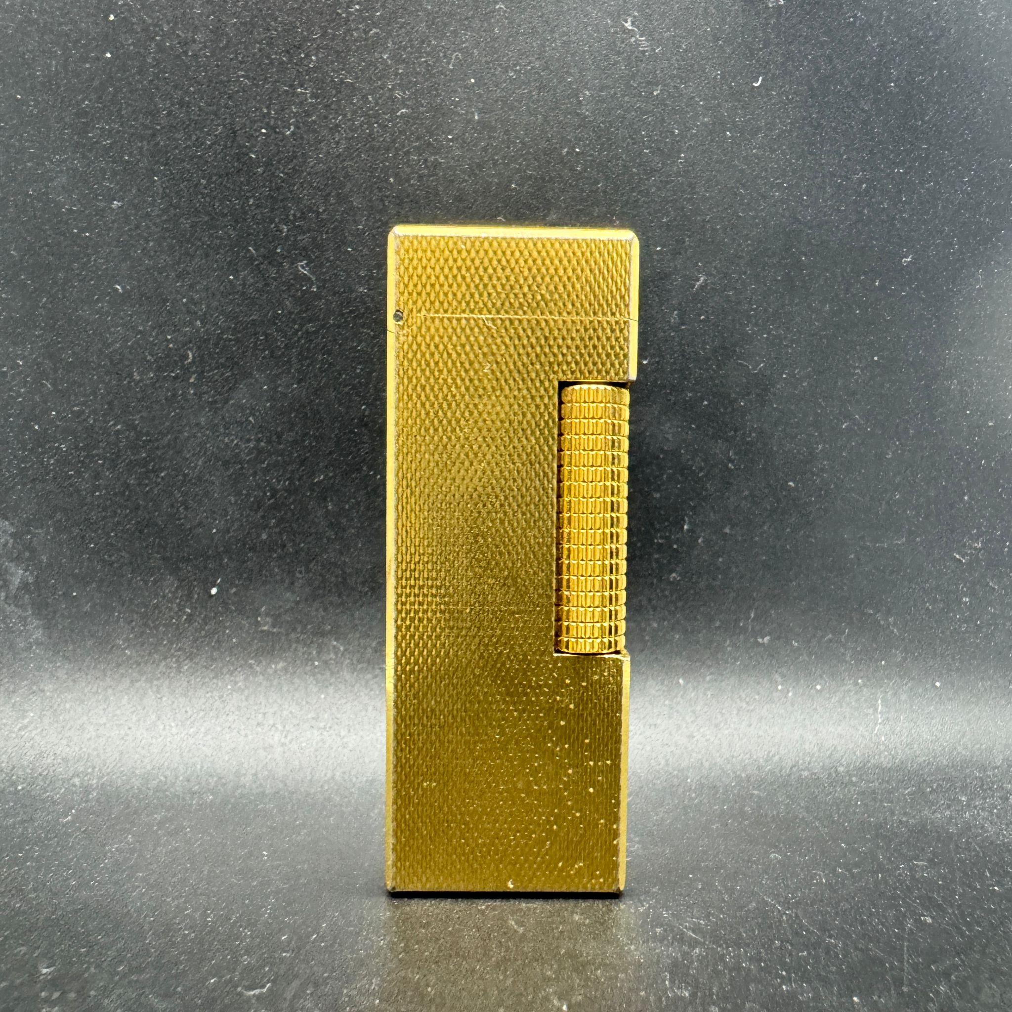The James Bond Iconic and Rare Vintage Dunhill Gold and Swiss Made Lighter 12