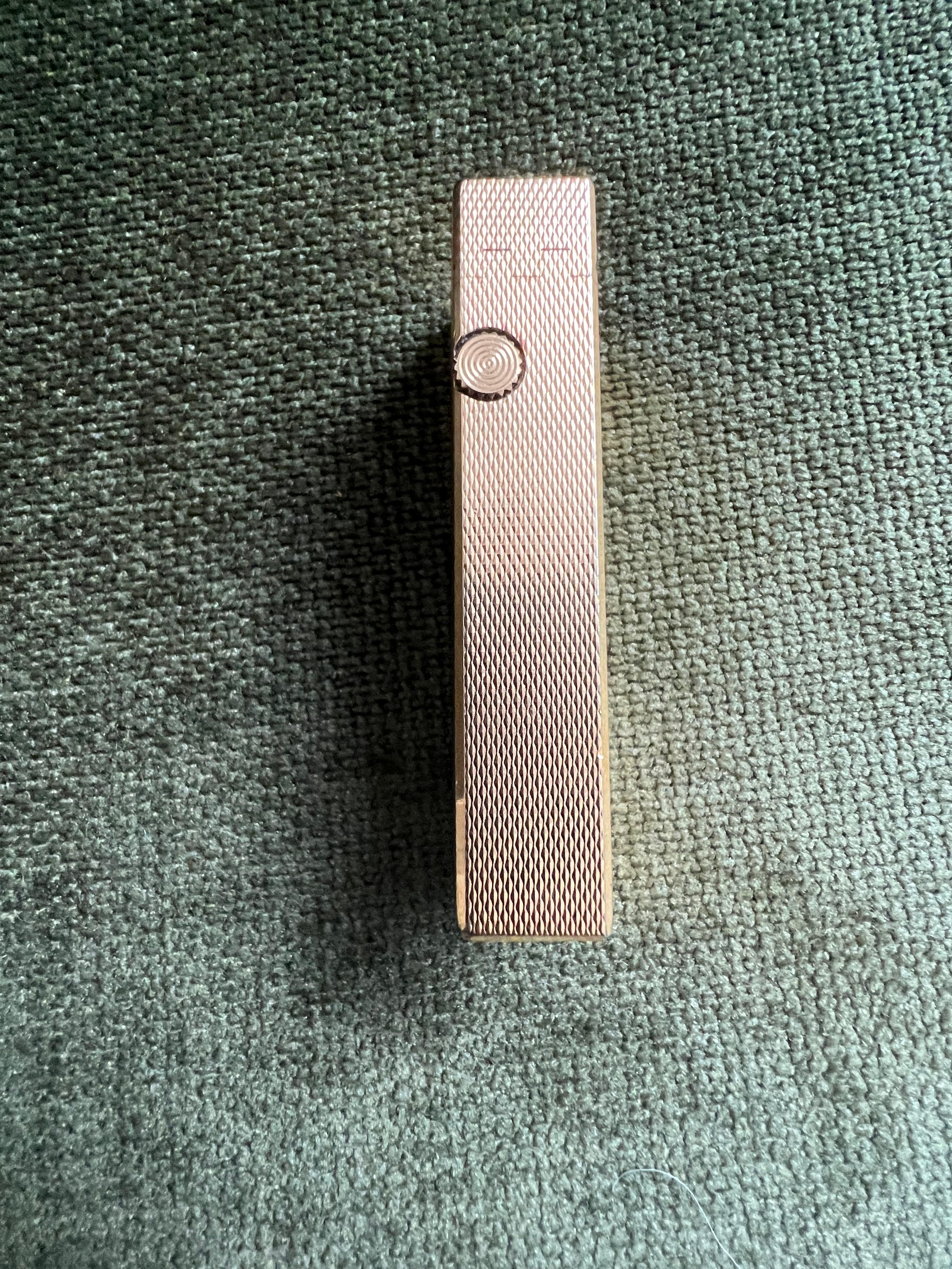 The James Bond Iconic and Rare Vintage Dunhill Gold and Swiss Made Lighter 1