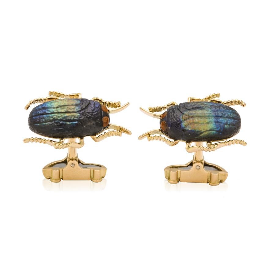 A fusion of nature, nostalgia, and fine craftsmanship—these one-of-a-kind cufflinks are carved from natural spectrolite, a rare gemstone prized for its iridescent play of color. Each front features a carved jewel beetle, its form glimmering in