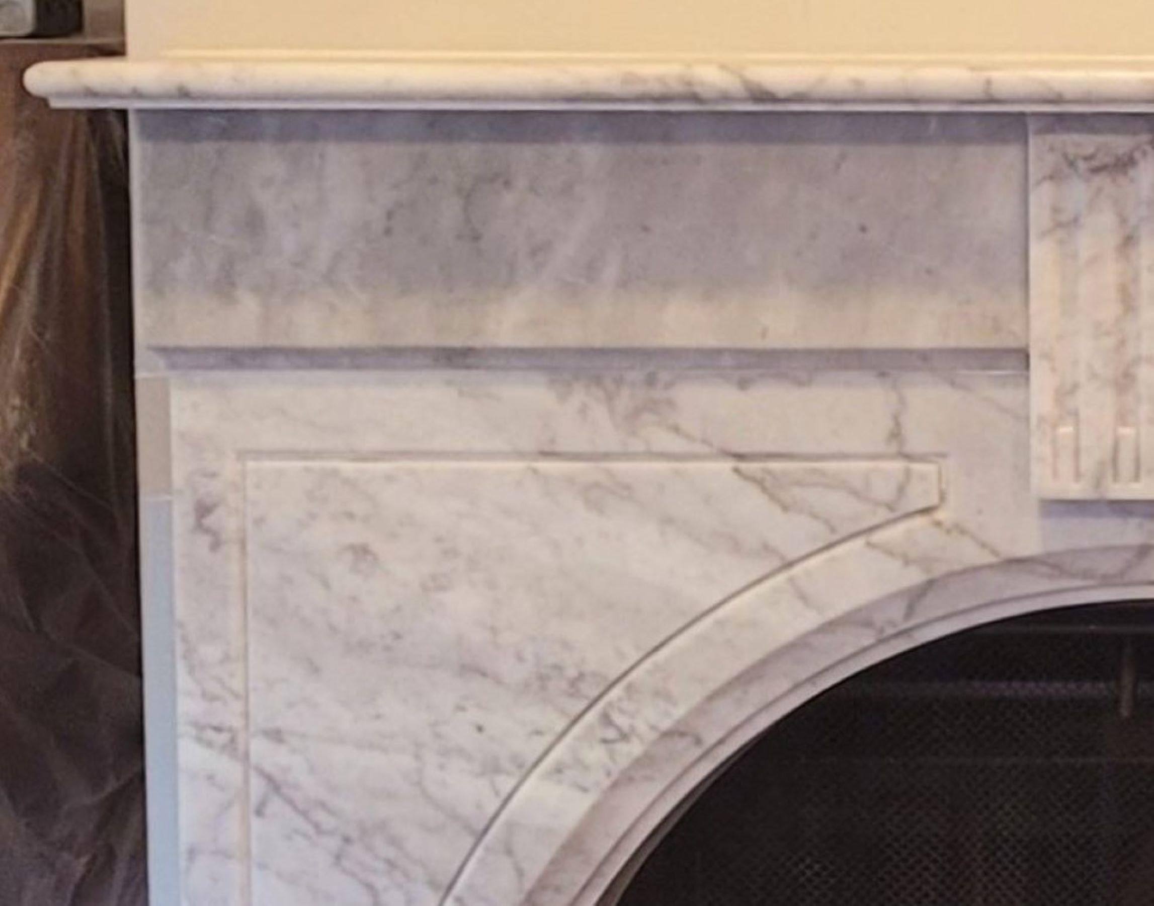 Carved The Josephine: A Classic Victorian-Styled Stone Fireplace with Arched Opening For Sale