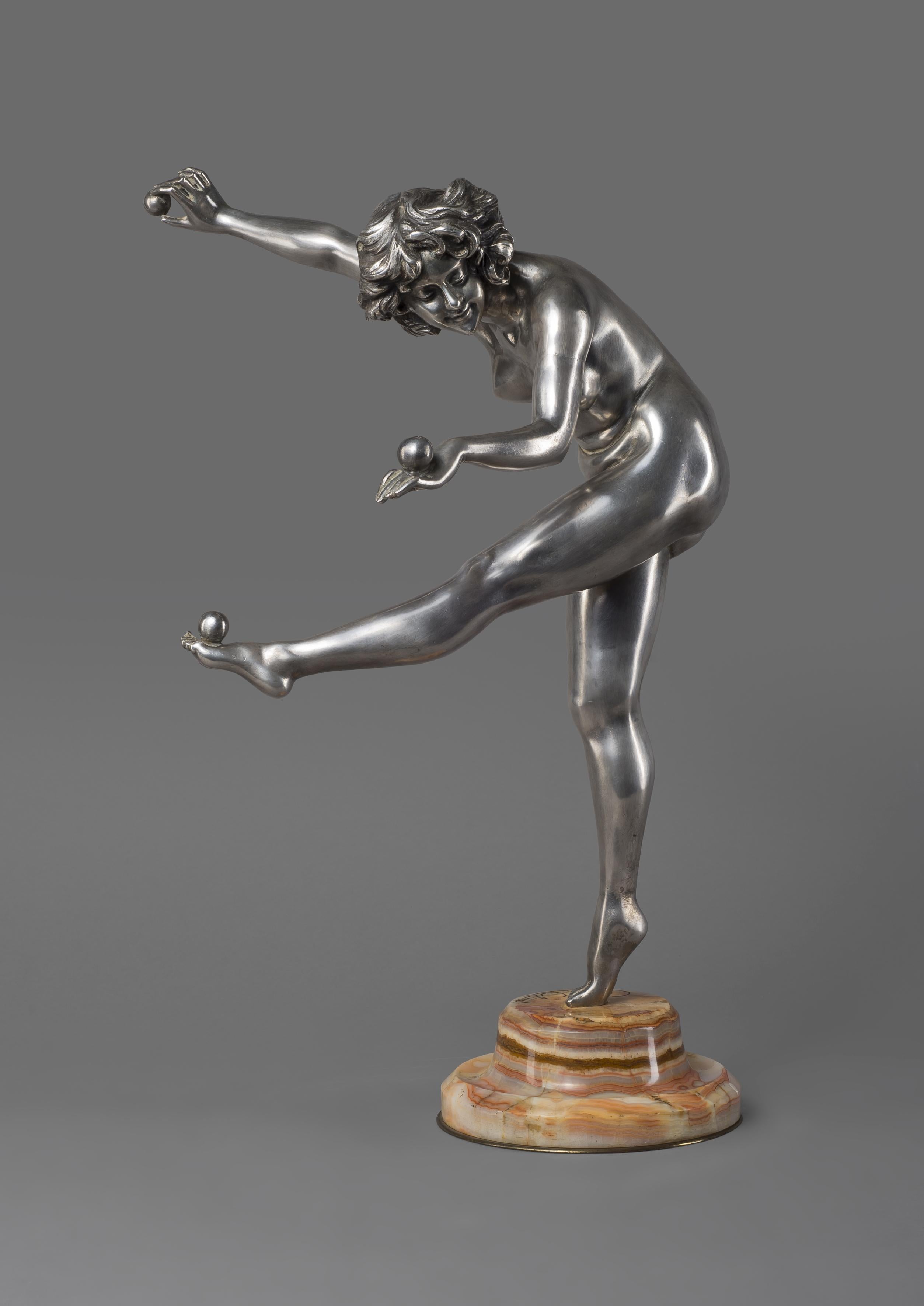 'The Juggler' - A fine Art Deco silvered bronze figure, by Claire J. R. Colinet. 

French, circa 1925. 

Engraved to base 'CL J.R. Colinet'.

This dramatic and large silvered bronze figure by Colinet depicts a nude female figure in an elegant