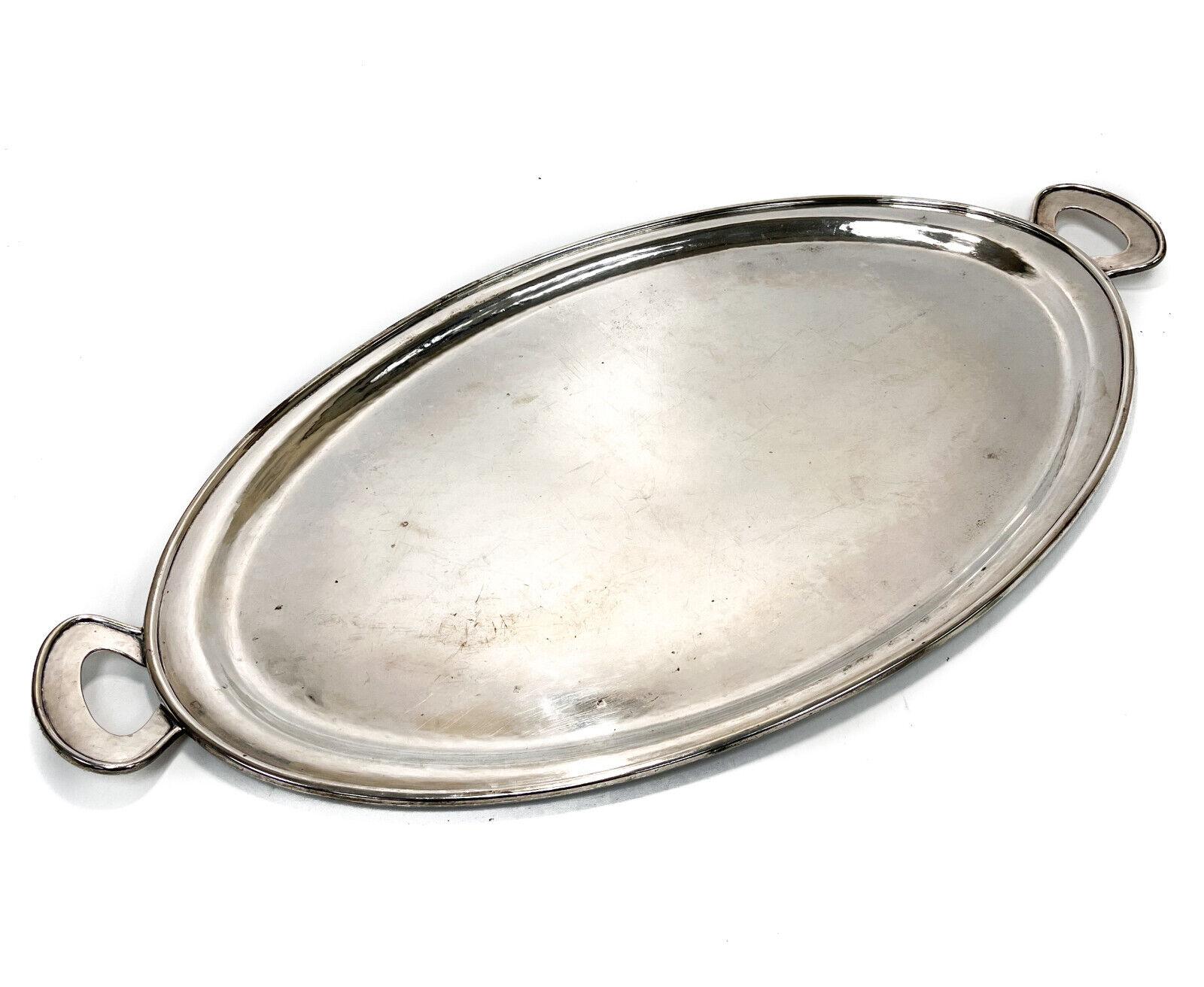 The Kalo Shops sterling silver hand wrought handled oval serving tray #208, circa 1910. The Kalo Shops sterling silver mark to underside base and inscribed  