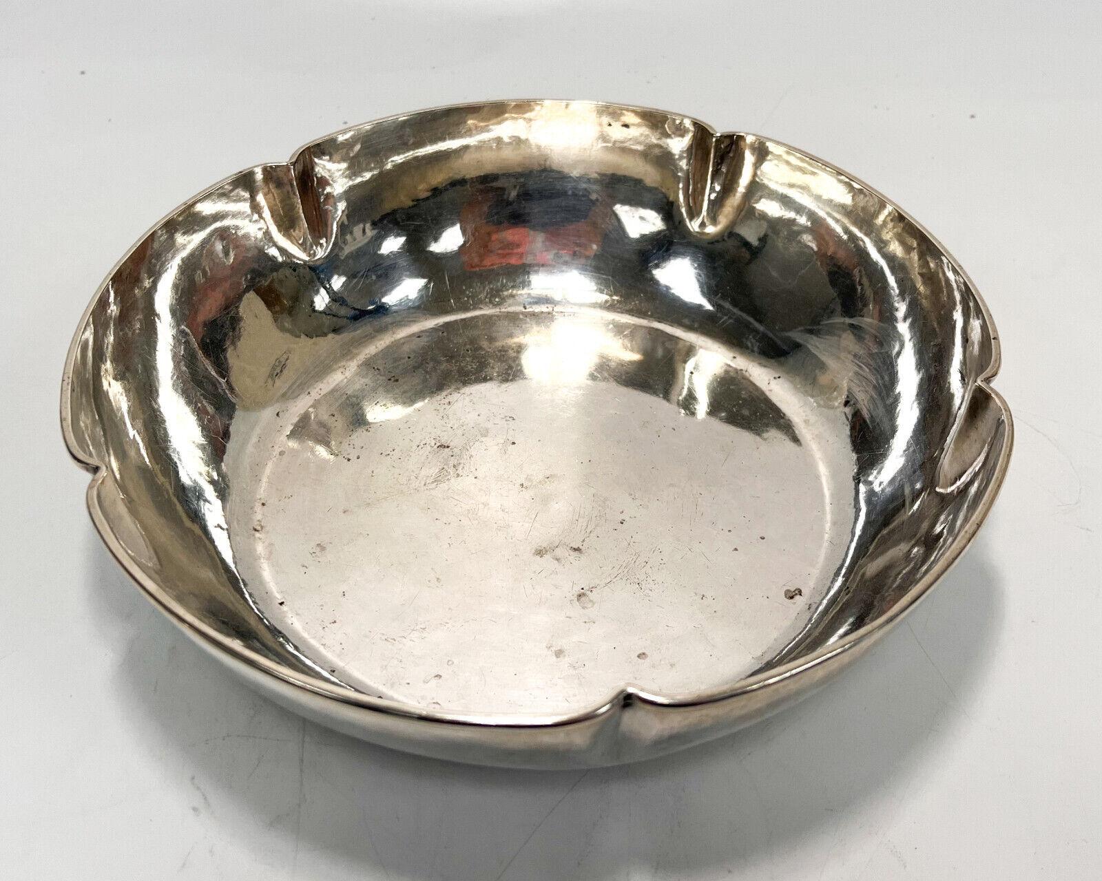 The Kalo Shops sterling silver hand wrought scalloped bowl #40, circa 1920. The Kalo Shops sterling silver mark to underside base.

Additional Information: 
Type: Scalloped Bowl
Material: Sterling Silver
Weight Approx., 18.19 ozt
Measures Approx.,