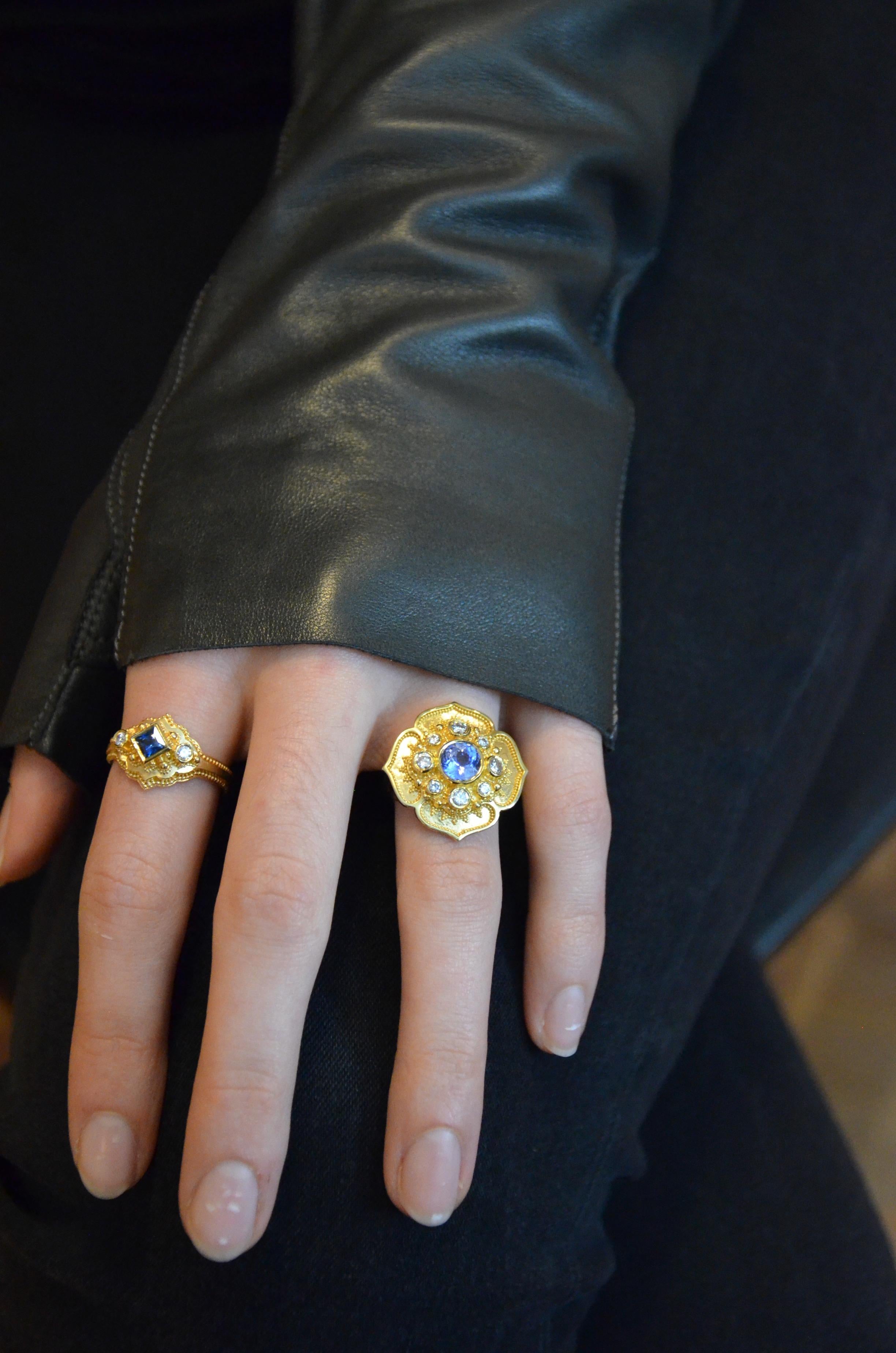 From the Kent Raible limited edition Studio Collection, we present the Flower Cocktail Ring.

This four petaled blossom features fine 18karat gold granulation with a gorgeous 7mm natural unheated Blue Sapphire surrounded by the sparkle of