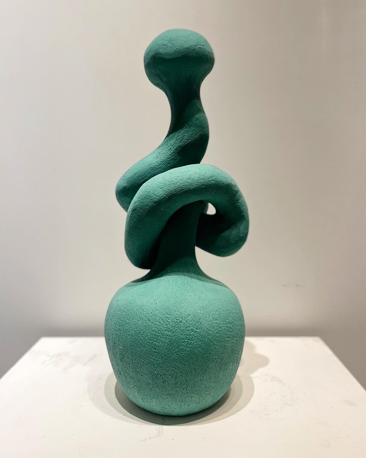 The Knot table sculpture or lamp, handmade in recycled stoneware clay and shown here in Wintergreen, by artist Stef Duffy. 

Measures approx 25” height x 8” diameter. Can be wired for use as a table lamp (form is hollow and has a hole at bottom