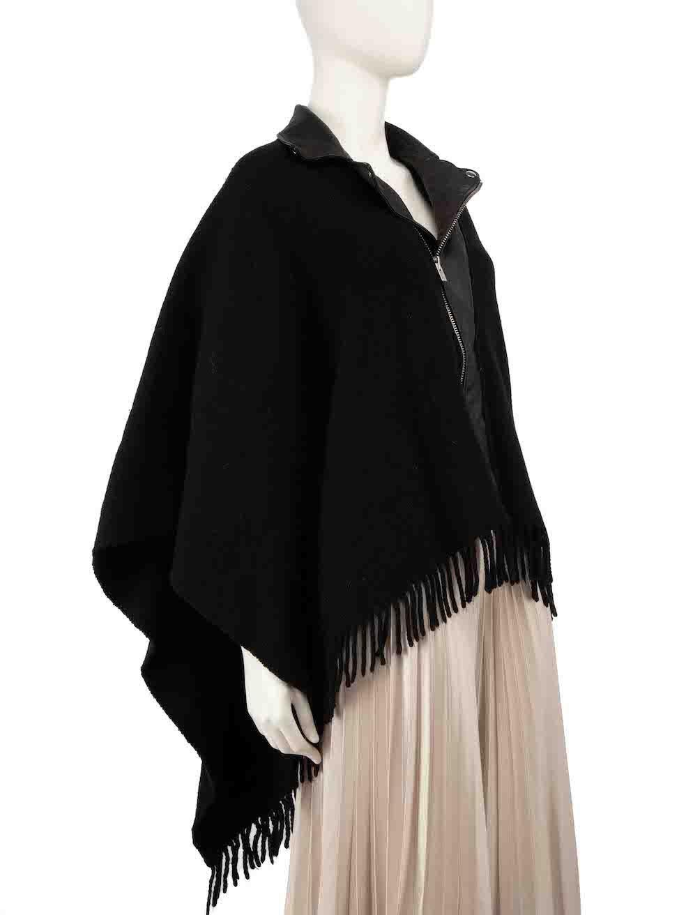 CONDITION is Very good. Hardly any visible wear to poncho is evident on this used The Kooples designer resale item.
 
 
 
 Details
 
 
 Black
 
 Wool
 
 Poncho
 
 Leather collar trim
 
 Zip fastening
 
 Fringe hem
 
 
 
 
 
 Made in Italy
 
 
 
