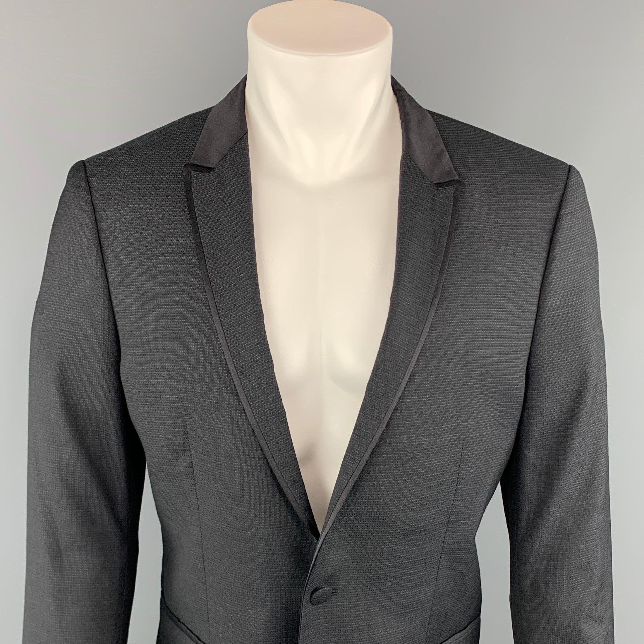 THE KOOPLES sport coat comes in a black nailhead wool with a peak lapel and a single button closure.
Excellent Pre-Owned Condition.
 

Marked:   52 

Measurements: 
 
Shoulder: 17 inches 
Chest: 40 inches 
Sleeve: 26.5 inches 
Length: 27.5 inches 
 