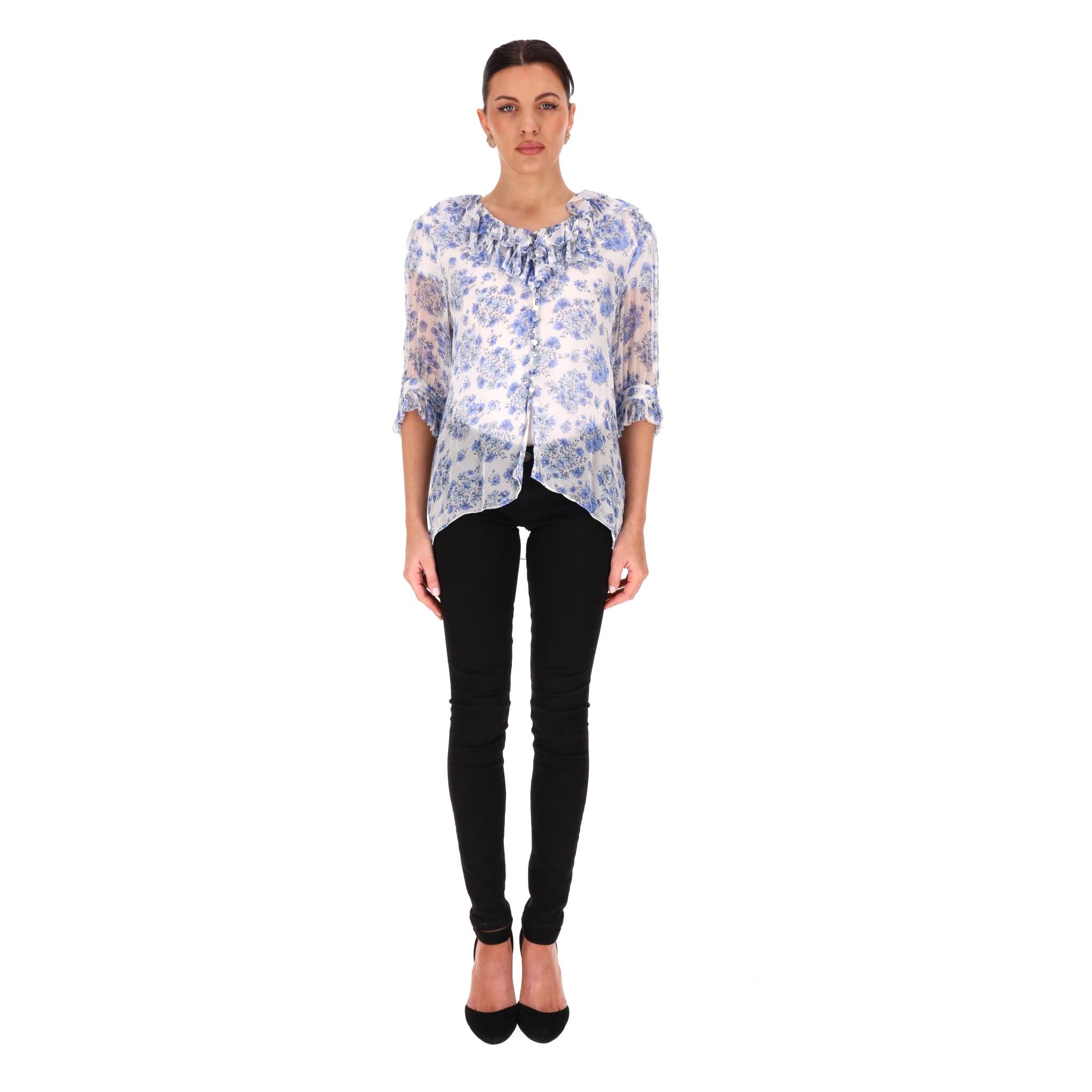 The Kooples Floral Frill Detail Sheer Top

White top designed with blue floral pattern and detailed with frill trimmed neckline and cuffs.

Semi-transparent flowing fabric, button fastening along the front.

Rrp Approx. £240

Size – 3 - M

Condition
