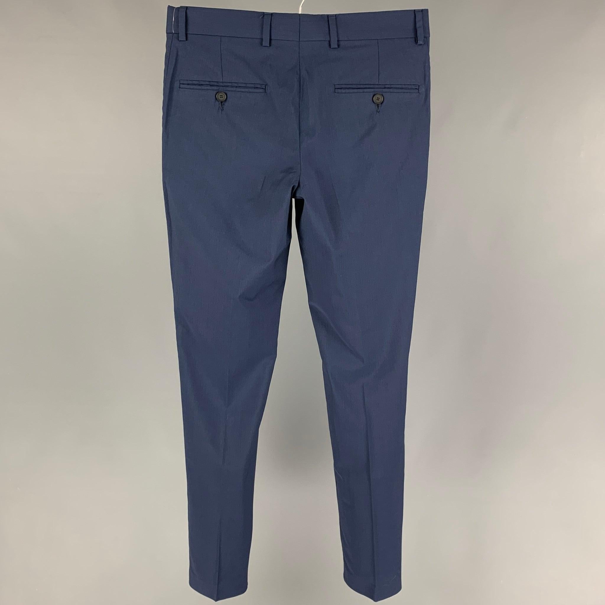 THE KOOPLES dress pants comes in a navy wool featuring a slim fit, front tab, and a zip fly closure.
Very Good
Pre-Owned Condition. 

Marked:   44 

Measurements: 
  Waist: 30 inches  Rise: 9 inches Inseam: 33 inches 
  
  
 
Reference: