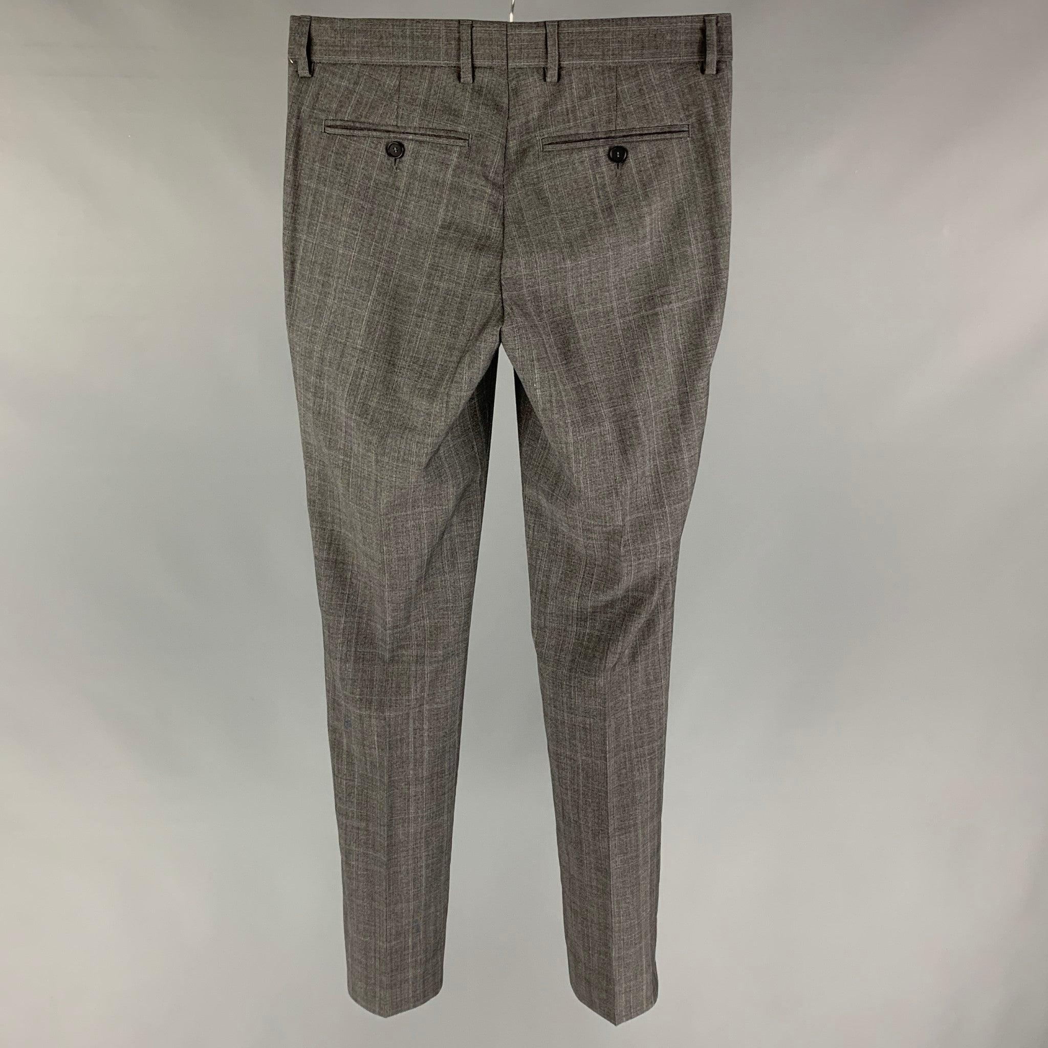 THE KOOPLES dress pants comes in a grey plaid wool 
featuring a slim fit, front tab, and a zip fly closure.
Excellent
Pre-Owned Condition. 

Marked:   44 

Measurements: 
  Waist: 30 inches Rise: 9 inches Inseam: 32 inches Leg Opening: 12 inches 
 