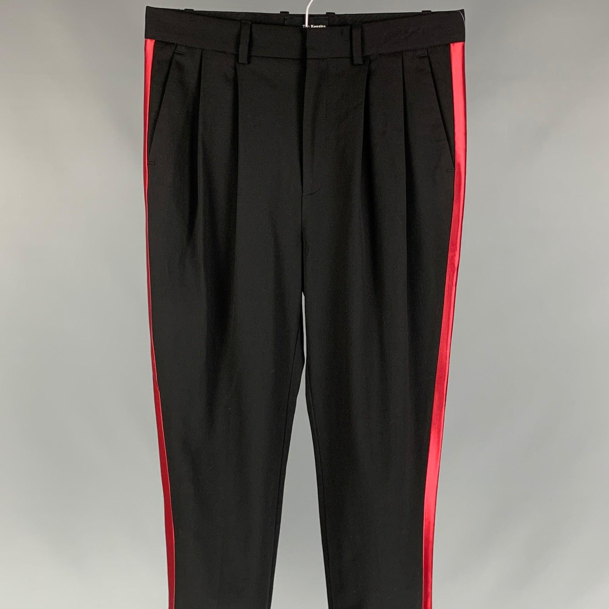THE KOOPLES tuxedo dress pants comes in black & red wool featuring a pleated style, slim fit, and a zip fly closure.
Very Good
Pre-Owned Condition. 

Marked:   Size tag removed.  

Measurements: 
  Waist: 31 inches  Rise: 11.5 inches  Inseam: 30