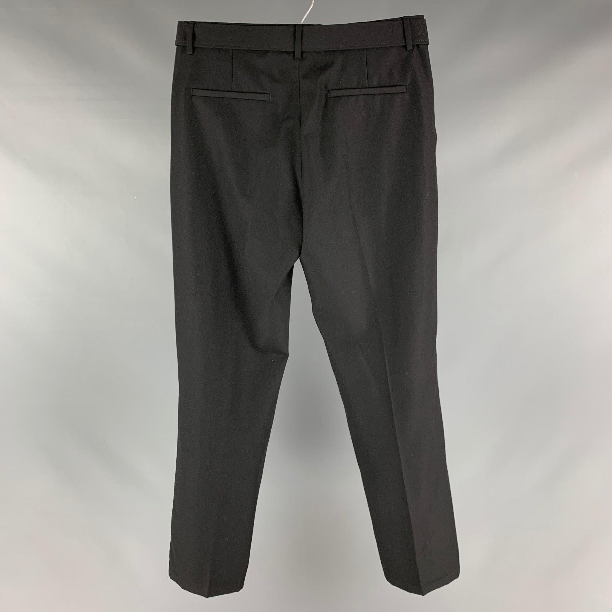 THE KOOPLES dress pants comes in a black wool woven material featuring a flat front style, and belted waist band.Excellent Pre-Owned Condition. 

Marked:  48 

Measurements: 
 Waist: 32 inches Rise: 10.5 inches Inseam: 29 inches 
 
 
Reference: