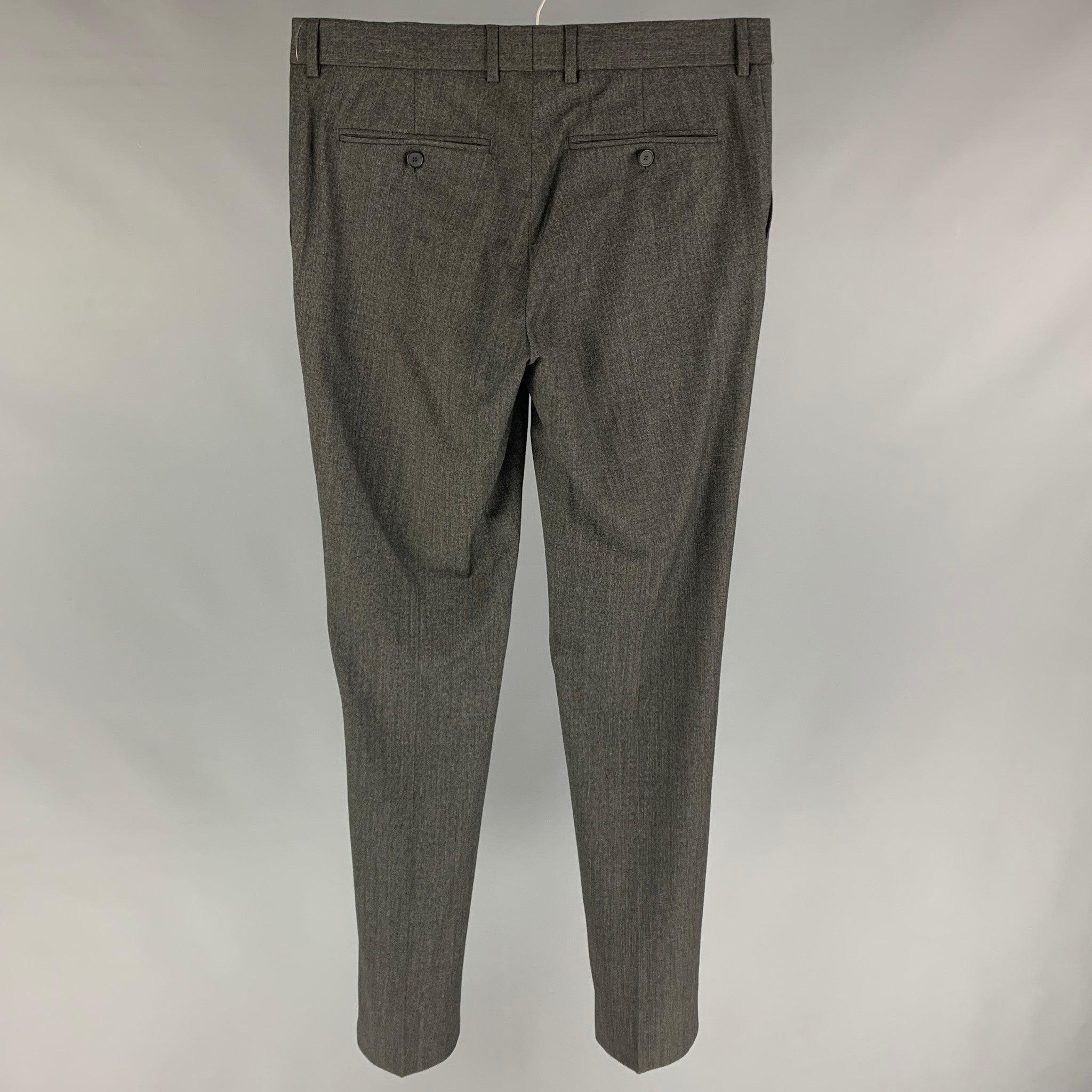 THE KOOPLES dress pants comes in a charcoal grid wool featuring a flat front, slim fit, front tag, and a zip fly closure.
New with tags.
 

Marked:   48 

Measurements: 
  Waist: 34 inches Rise: 9 inches Inseam: 34 inches Leg Opening: 14 inches 

 