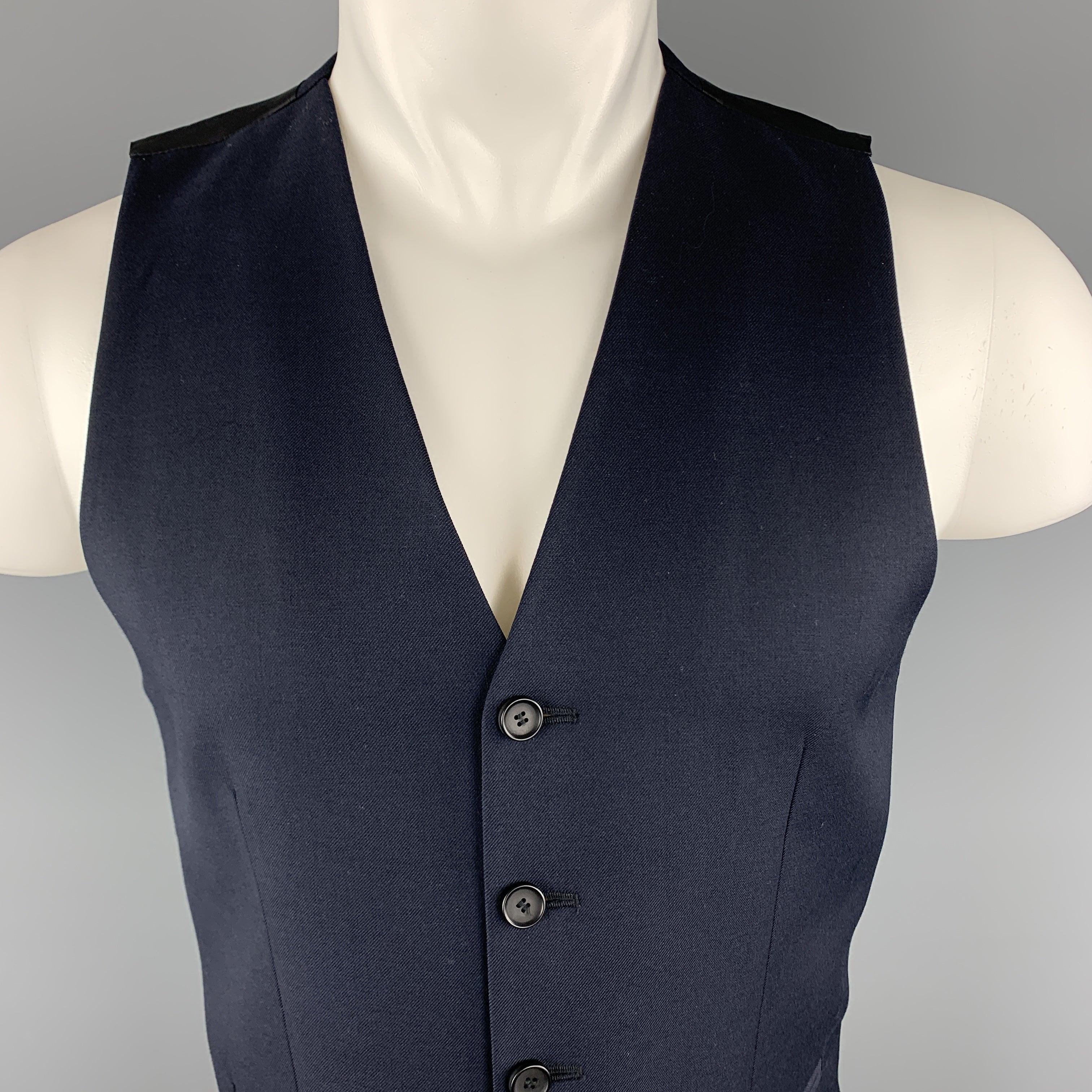 THE KOOPLES dress vest comes in navy blue wool with a black satin back.
New with Tags. 

Marked:   IT 46 

Measurements: 
 
Shoulder:
12 inches Chest:
37 inches Length: 24 inches 
  
  
 
Reference: 100771
Category: Vest (Formal)
More Details
   