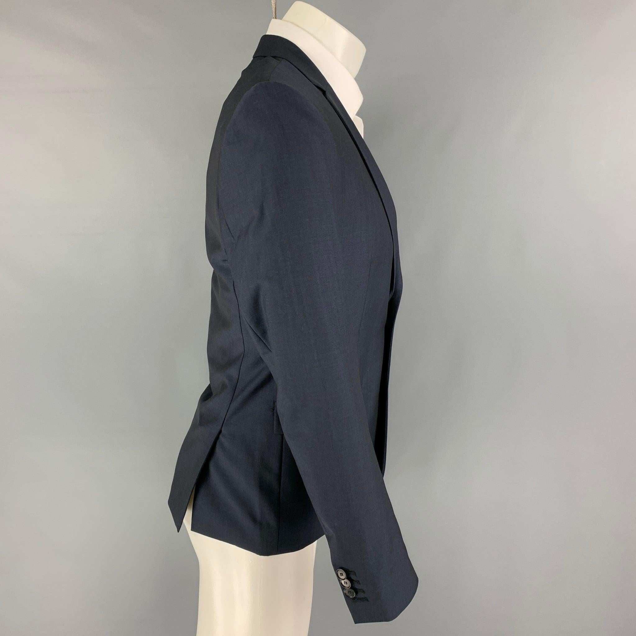 THE KOOPLES sport coat comes in a navy wool / mohair with a full liner featuring a notch lapel, flap pockets, double back vent, and a double button closure. New with tags. 

Marked:   46 

Measurements: 
 
Shoulder: 17.5 inches Chest: 38 inches